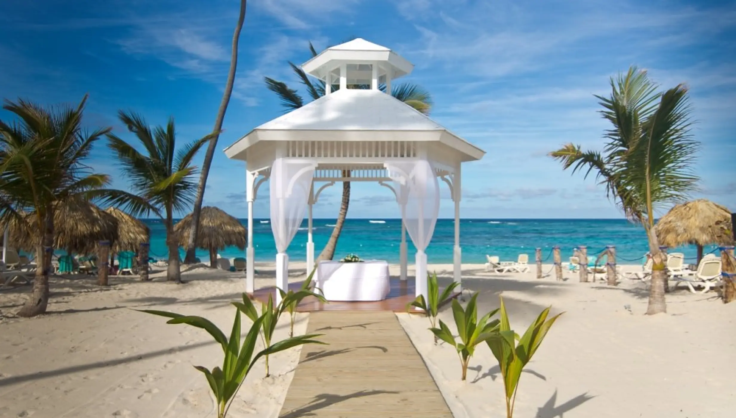 Beachfront wedding gazebo with white draping at Majestic Mirage, Punta Cana