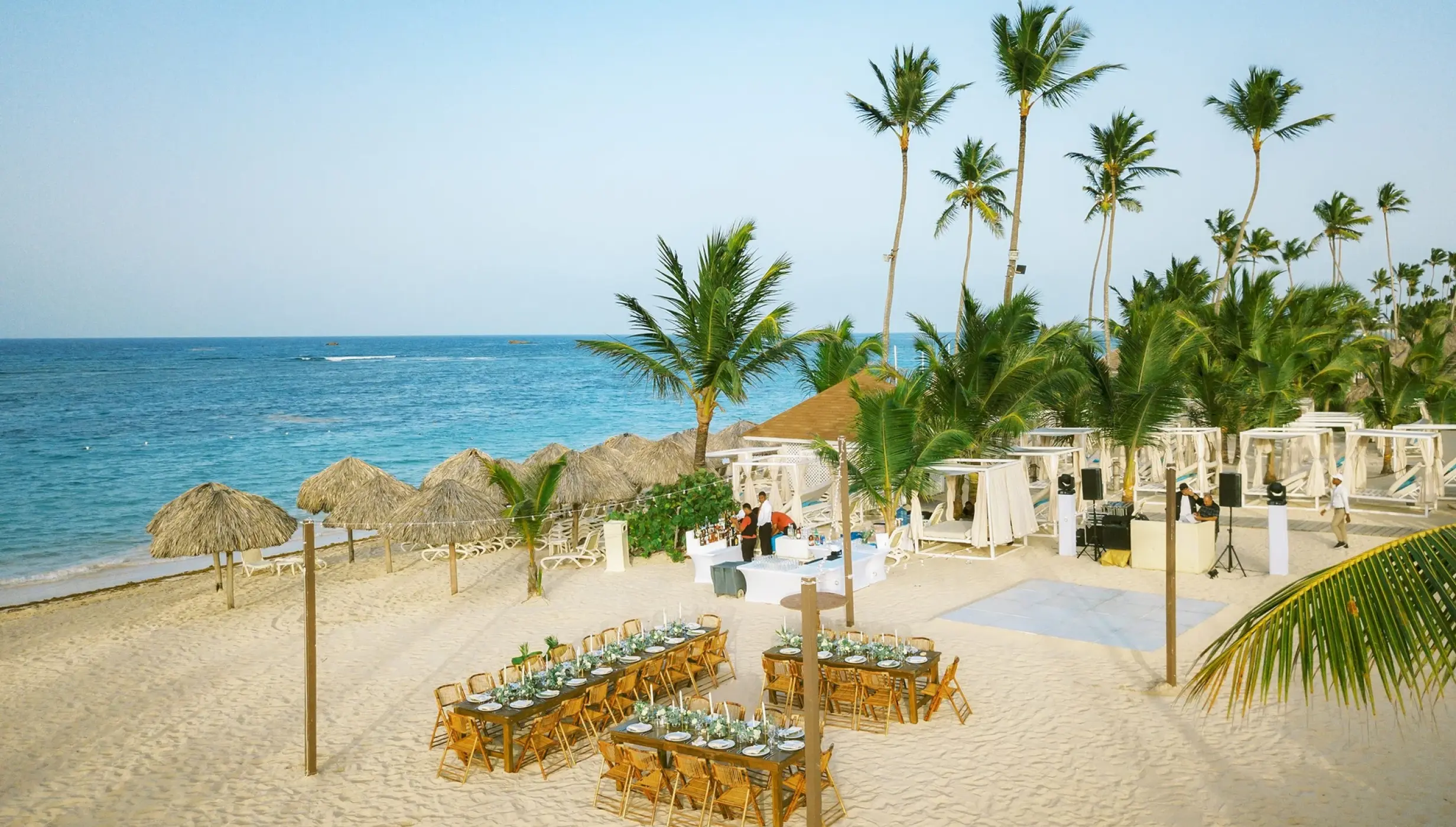 Beachfront wedding reception setup on the sand at Majestic Mirage, Punta Cana