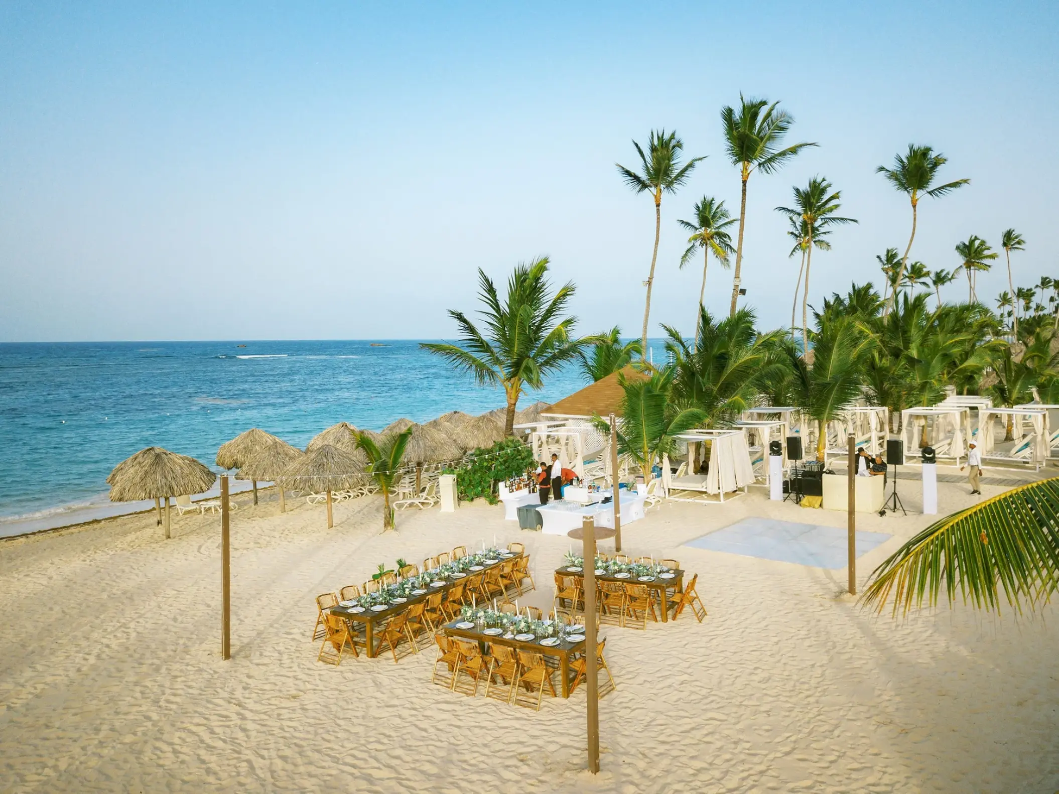 Beachfront wedding reception setup on the sand at Majestic Mirage, Punta Cana