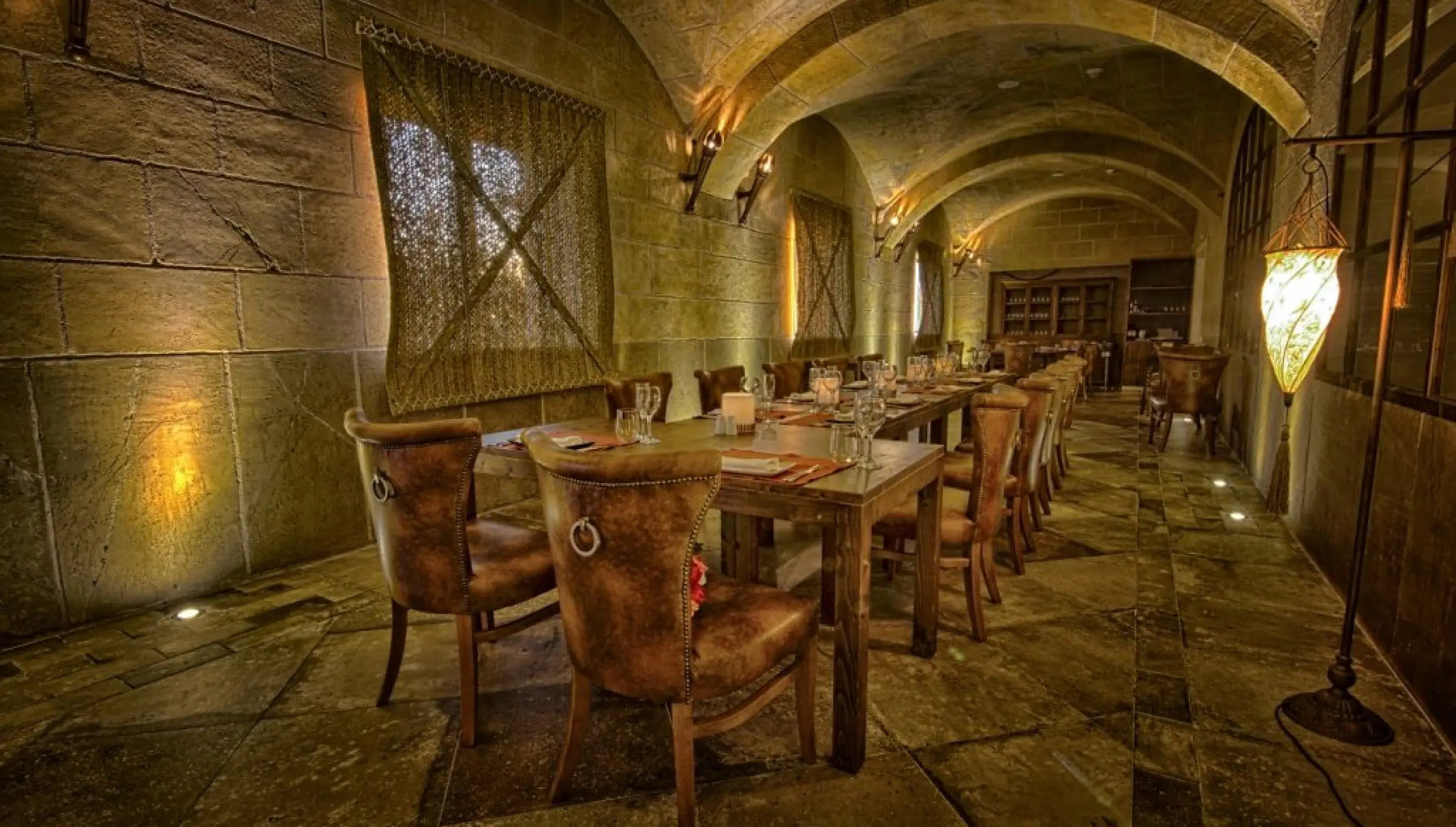 Stone-walled dining room setup for a wedding reception at Majestic Mirage, Punta Cana