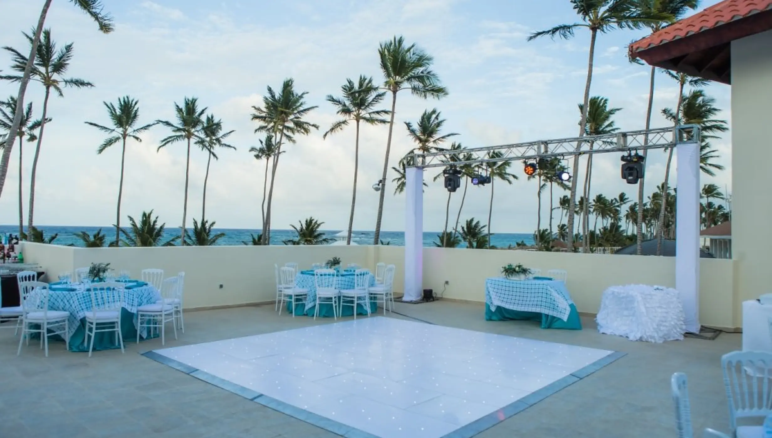 Rooftop wedding reception setup with a dance floor at Majestic Mirage Punta Cana