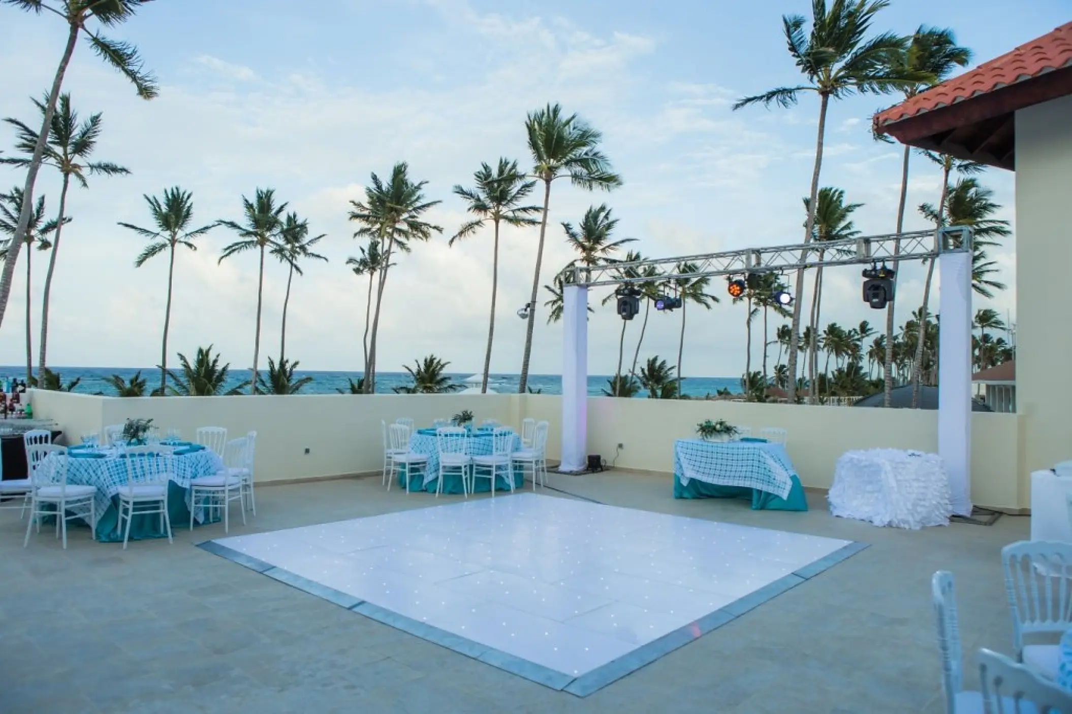 Rooftop wedding reception setup with a dance floor at Majestic Mirage Punta Cana