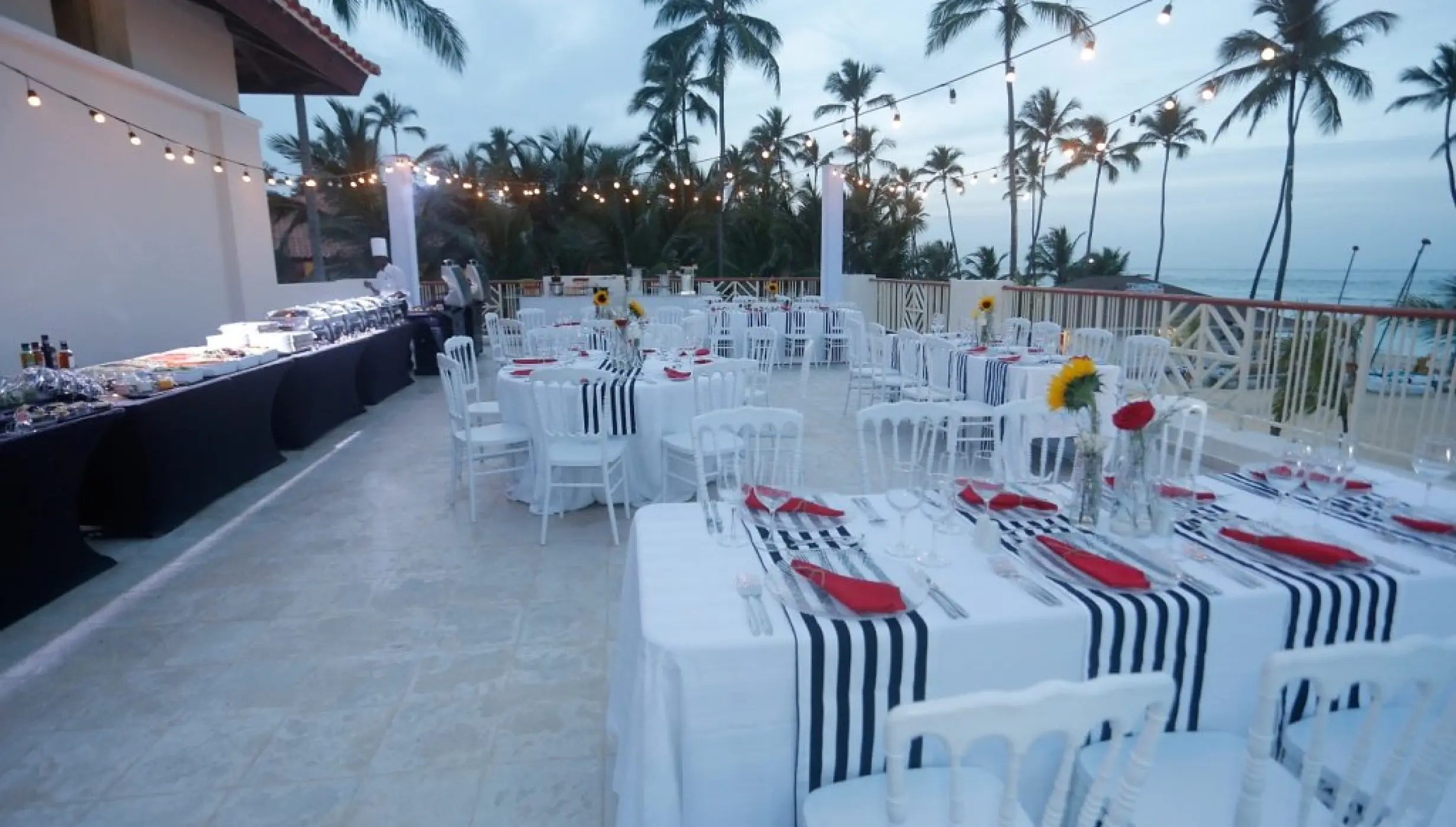 Private terrace wedding reception with string lights at Majestic Mirage, Punta Cana
