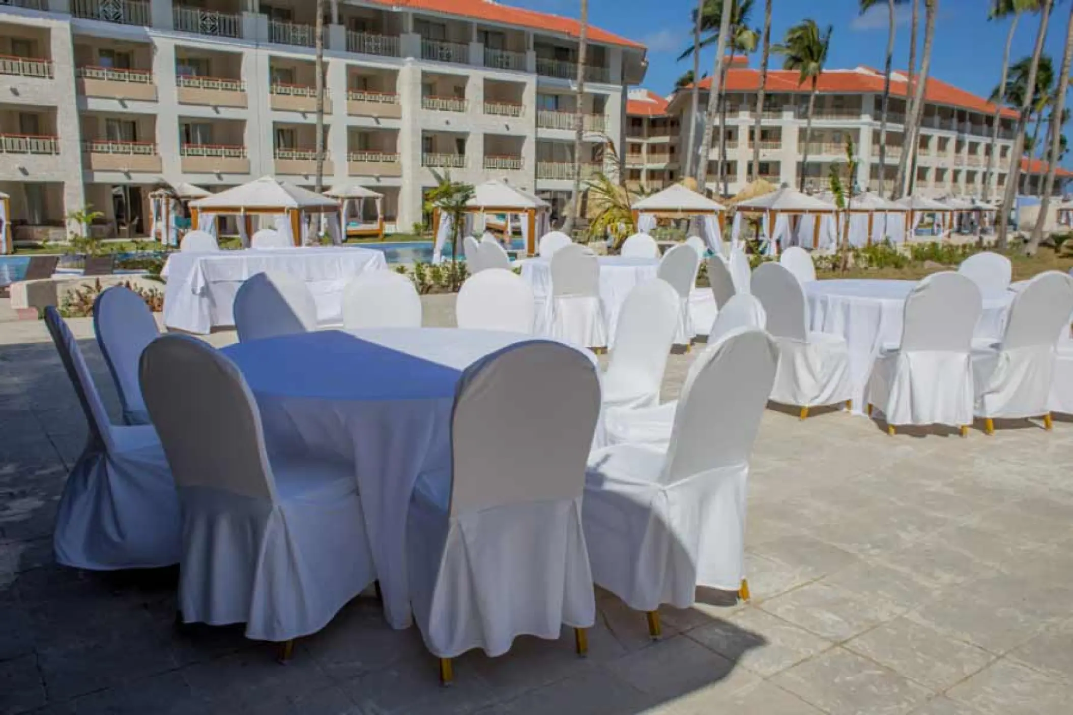 Outdoor wedding reception setup with white linens at Majestic Mirage, Punta Cana