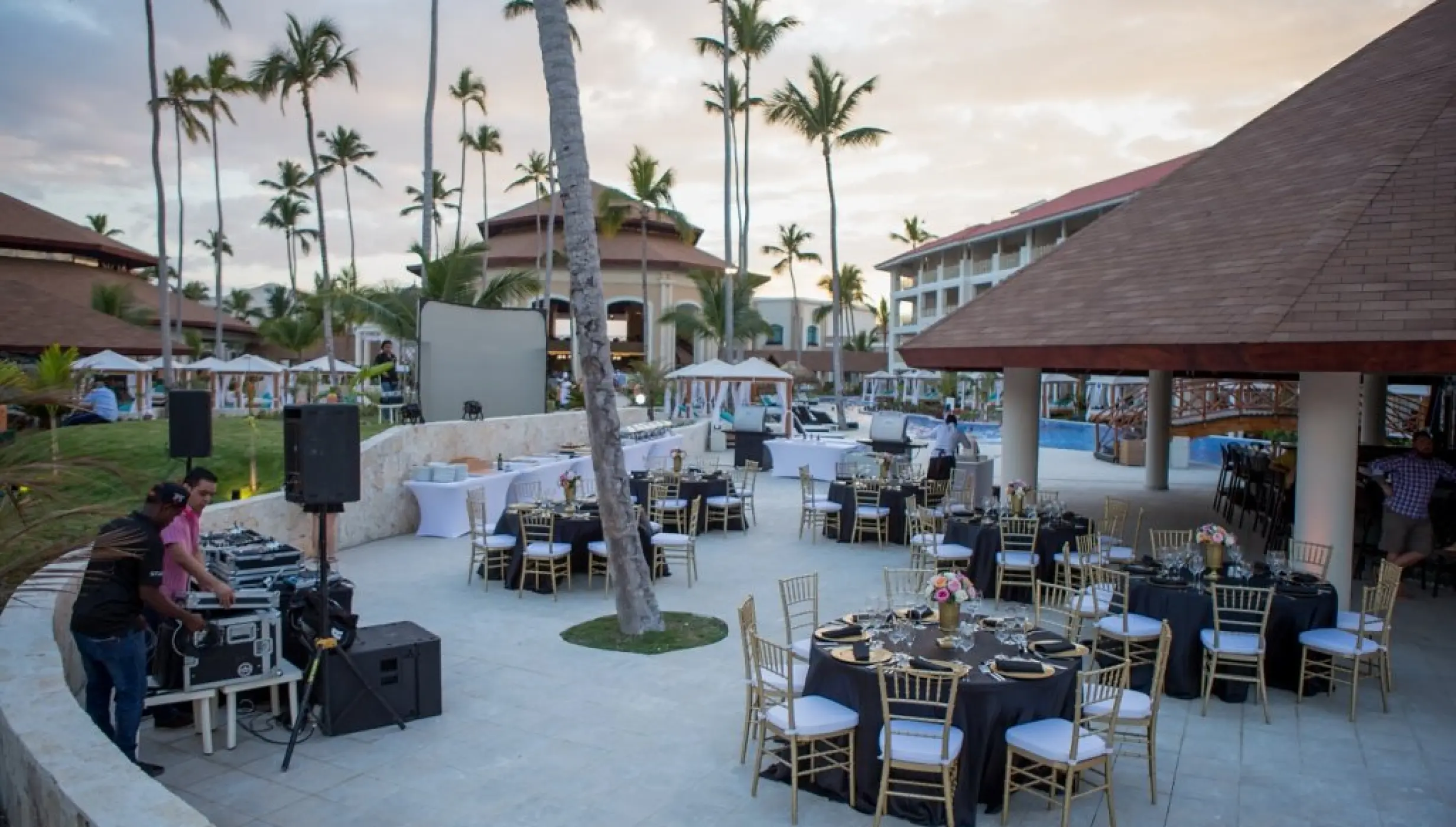 Outdoor wedding reception setup with gold chairs and black linens at Majestic Mirage, Punta Cana