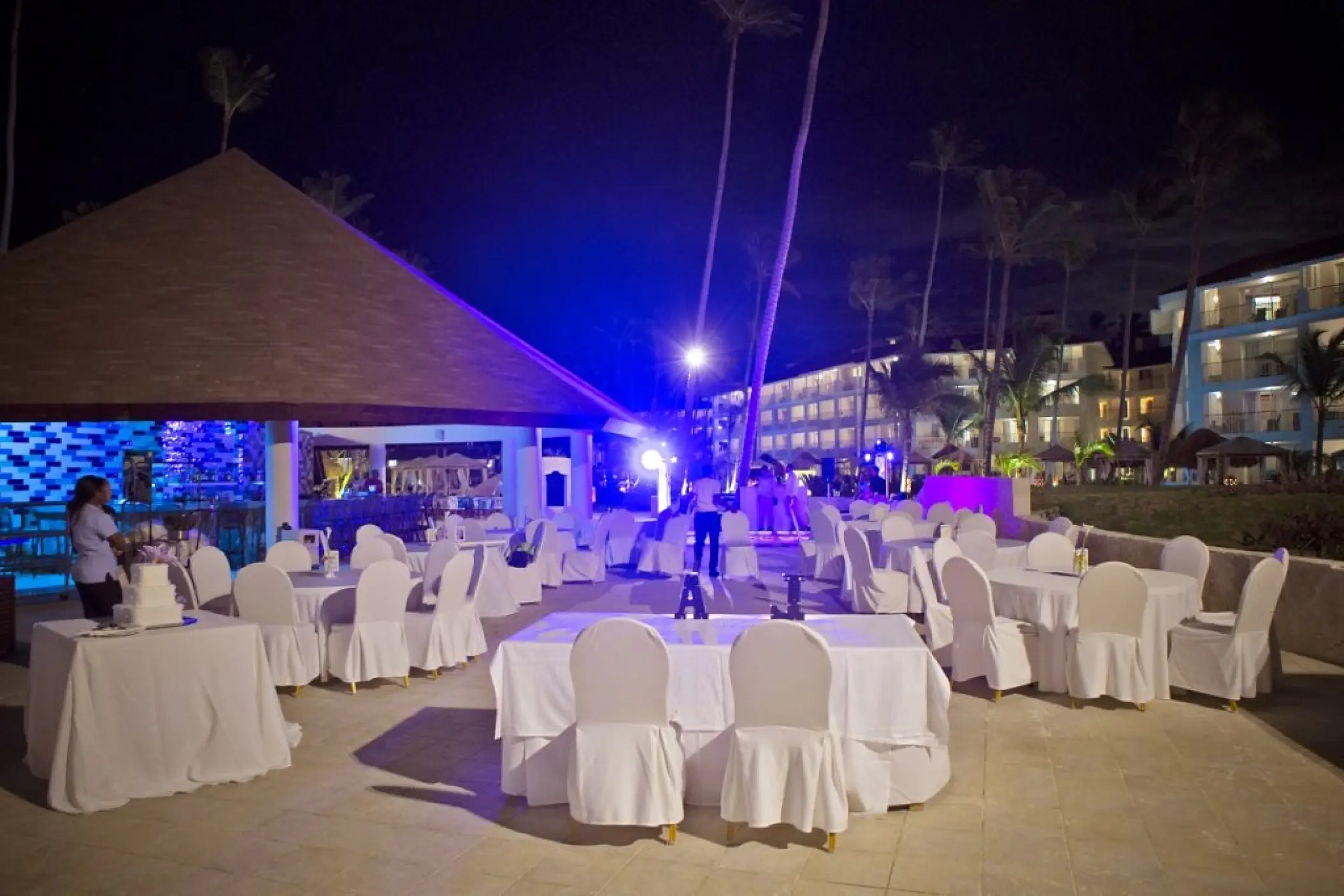 Outdoor night wedding reception with white linens at Majestic Mirage, Punta Cana
