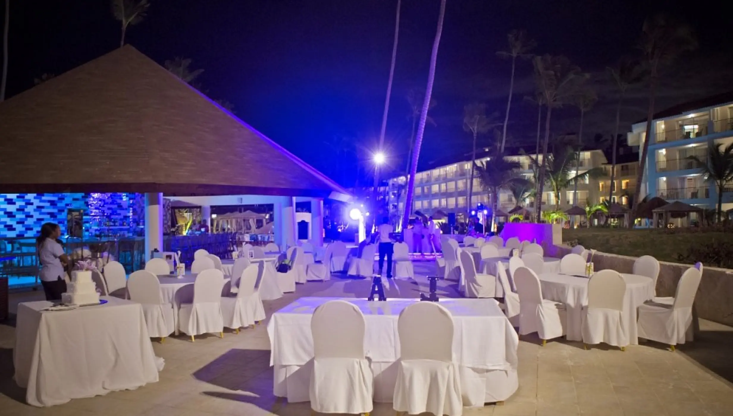 Outdoor night wedding reception with white linens at Majestic Mirage, Punta Cana