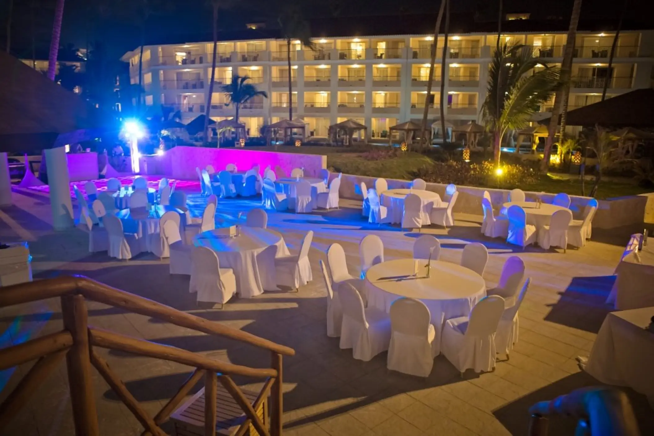 Outdoor wedding reception with blue and purple lighting at Majestic Mirage, Punta Cana