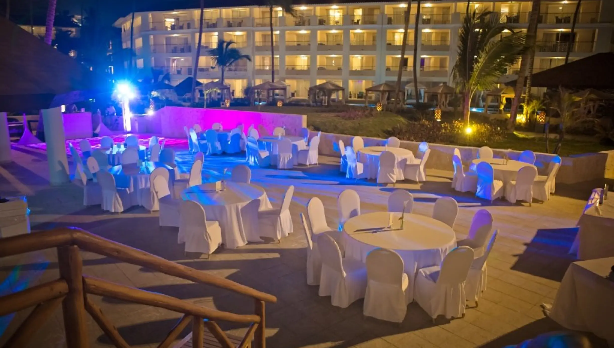 Outdoor wedding reception with blue and purple lighting at Majestic Mirage, Punta Cana