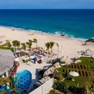 Aerial view of beach and lawn wedding ceremony setups at Mar Del Cabo, Cabo San Lucas