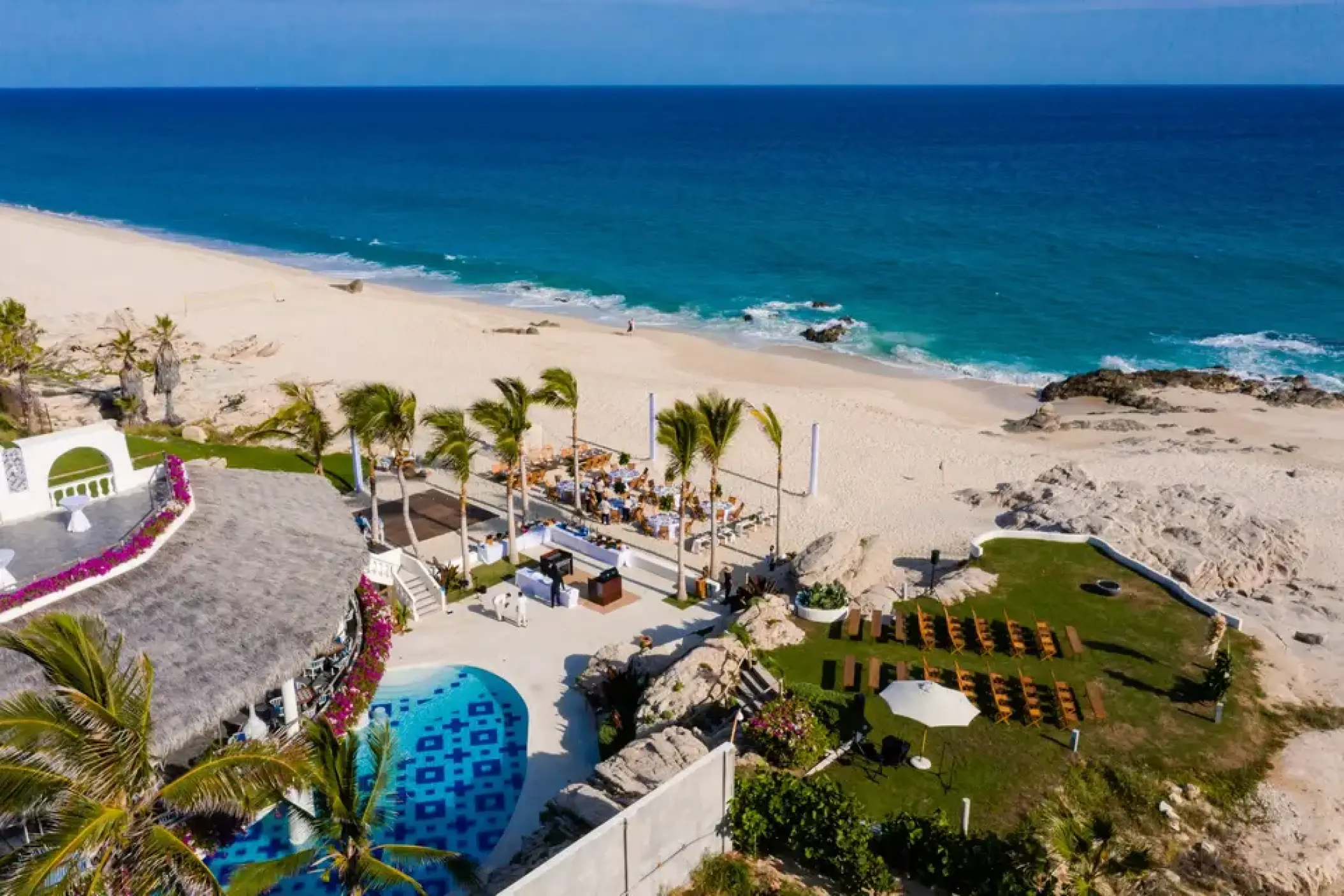 Aerial view of beach and lawn wedding ceremony setups at Mar Del Cabo, Cabo San Lucas