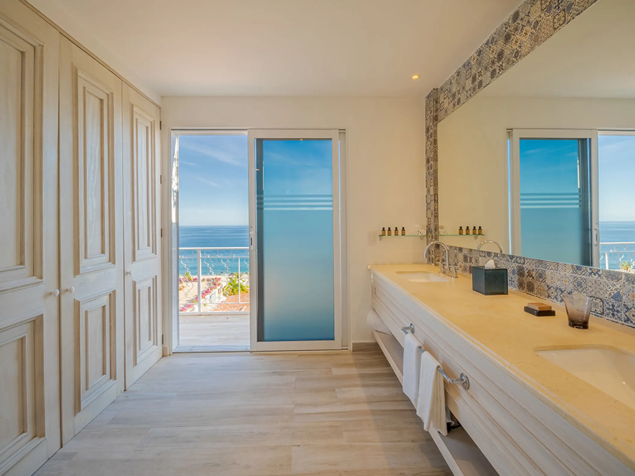Mar Del Cabo suite bathroom with double vanity and ocean-view balcony, Cabo San Lucas