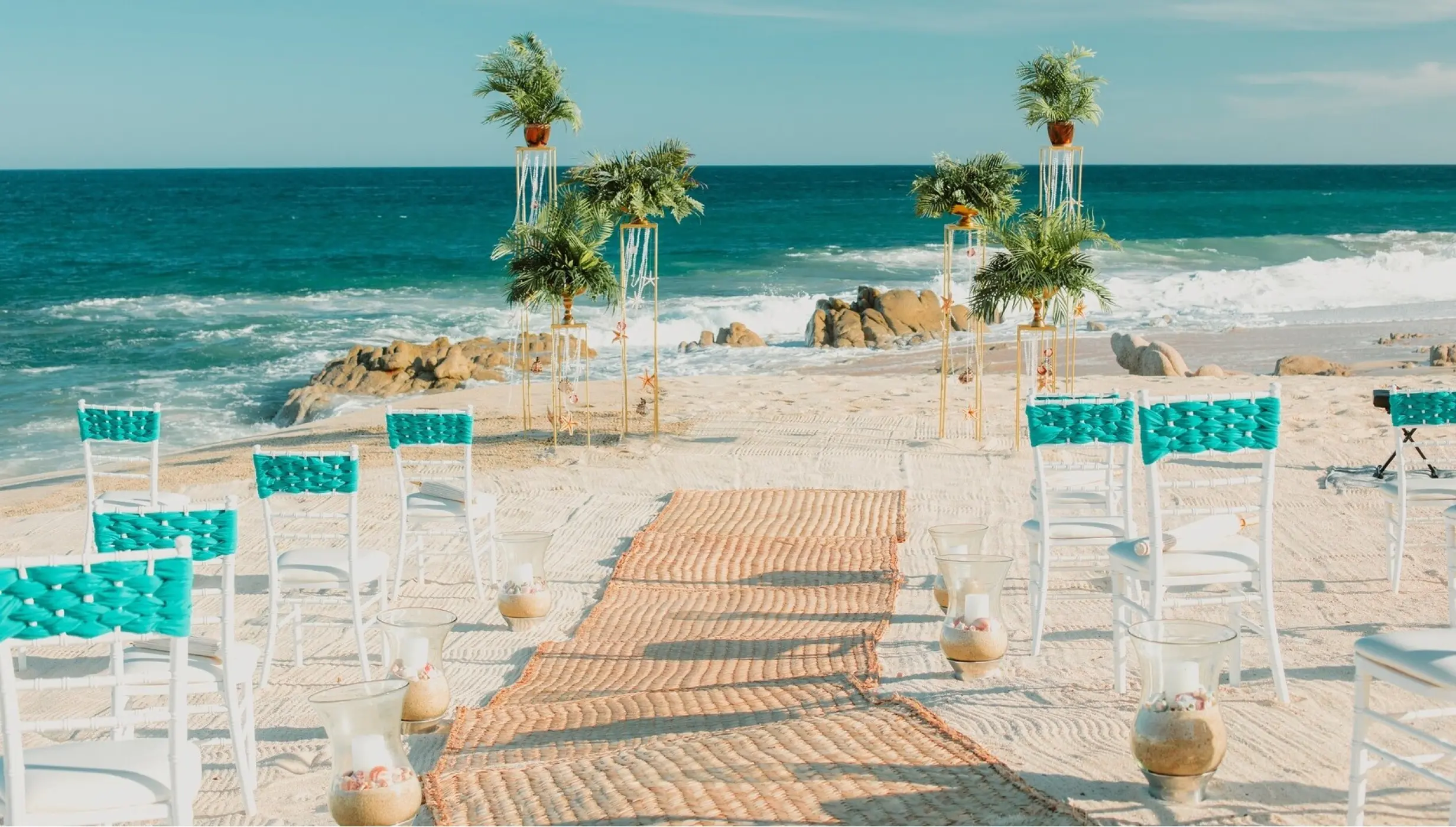 Ceremony decor on the beach at Mar del Cabo by Velas Resort