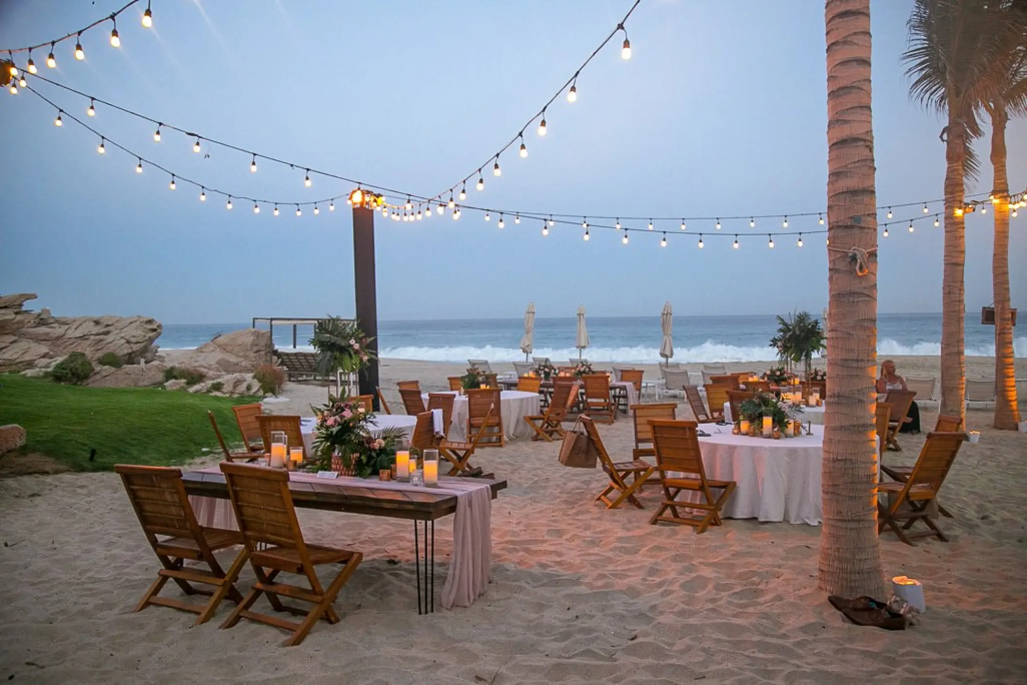 String lights over a beachfront wedding reception at Mar Del Cabo, Cabo San Lucas