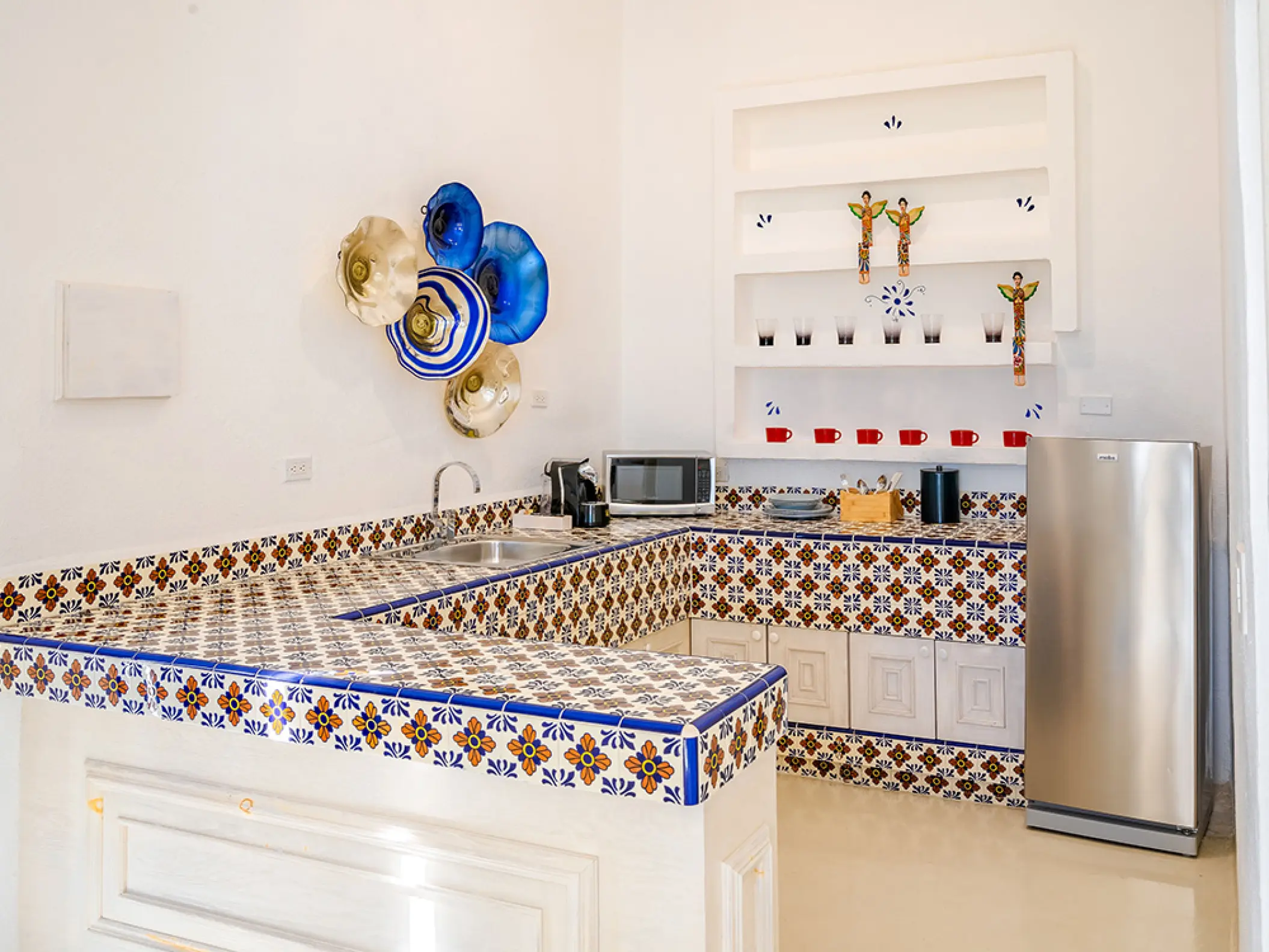 Mar Del Cabo suite kitchen with colorful tile countertops and modern appliances, Cabo San Lucas