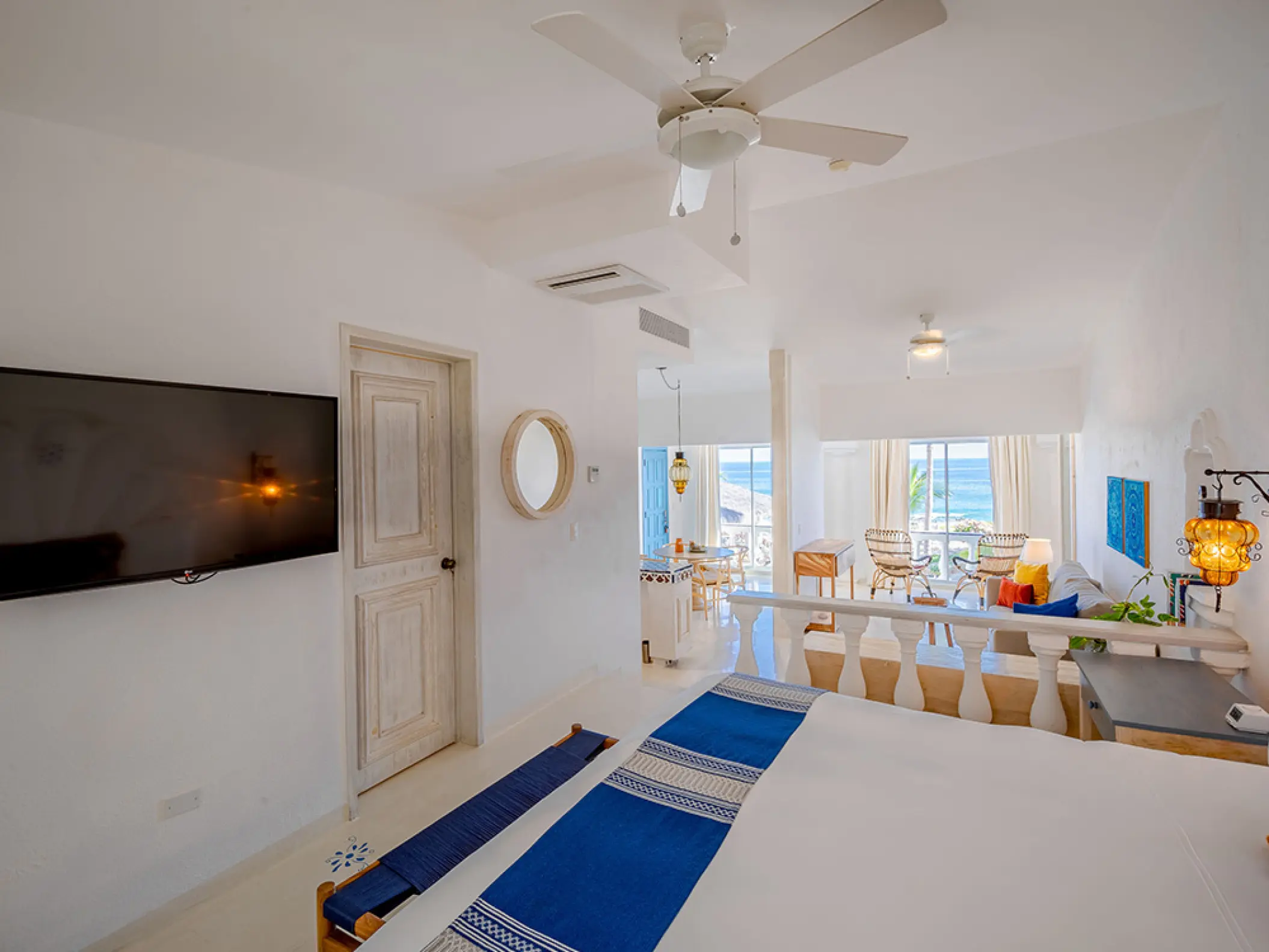 Mar Del Cabo guest suite with white walls, blue accents, and sea views, Cabo San Lucas
