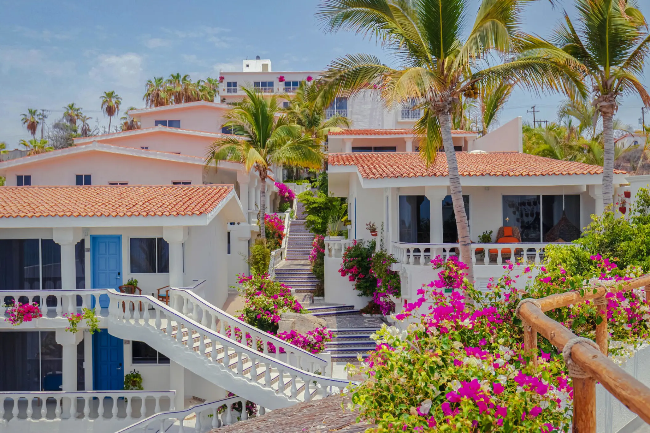 Mar Del Cabo guest suites with terracotta roofs and pink bougainvillea, Cabo San Lucas