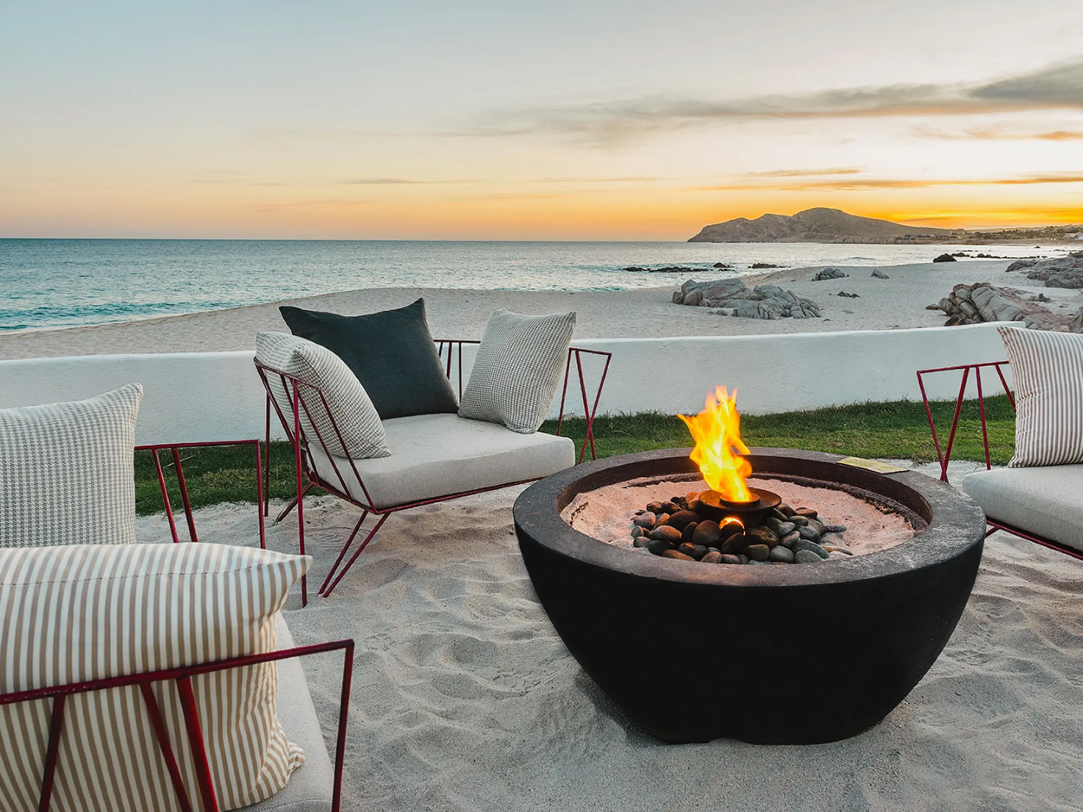 Beachfront lounge area with a fire pit at Mar Del Cabo, Cabo San Lucas