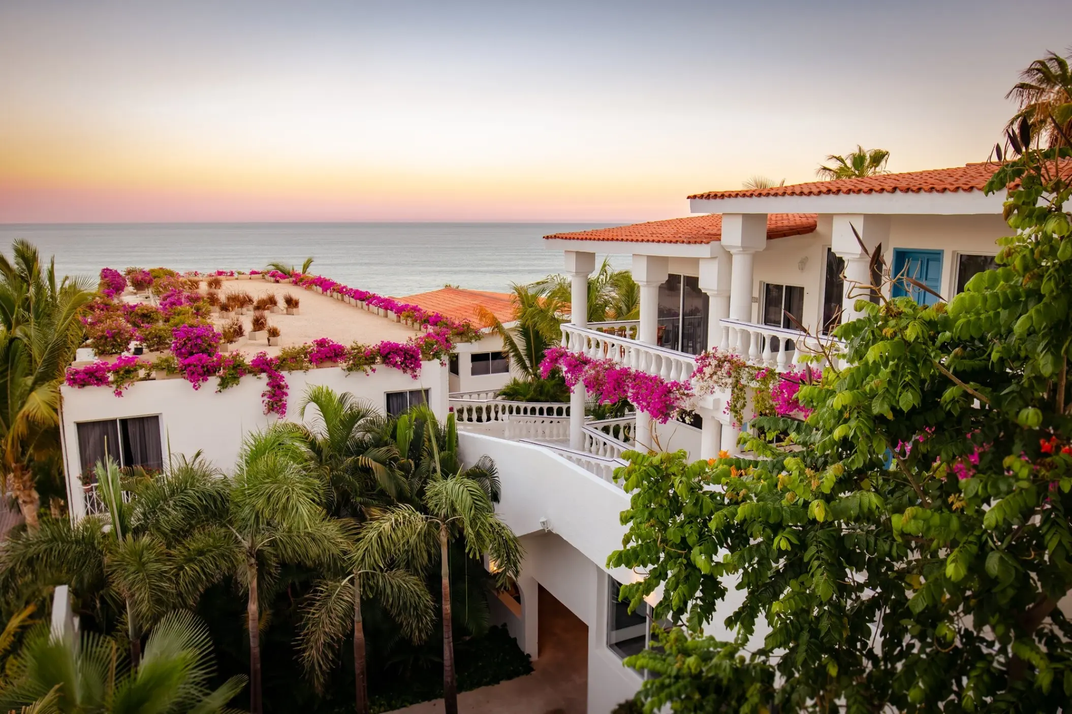 White boutique buildings with pink bougainvillea at Mar Del Cabo, Cabo San Lucas