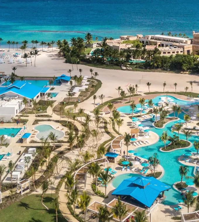 Aerial view of Margaritaville Island Reserve Cap Cana pools and beachfront, Punta Cana