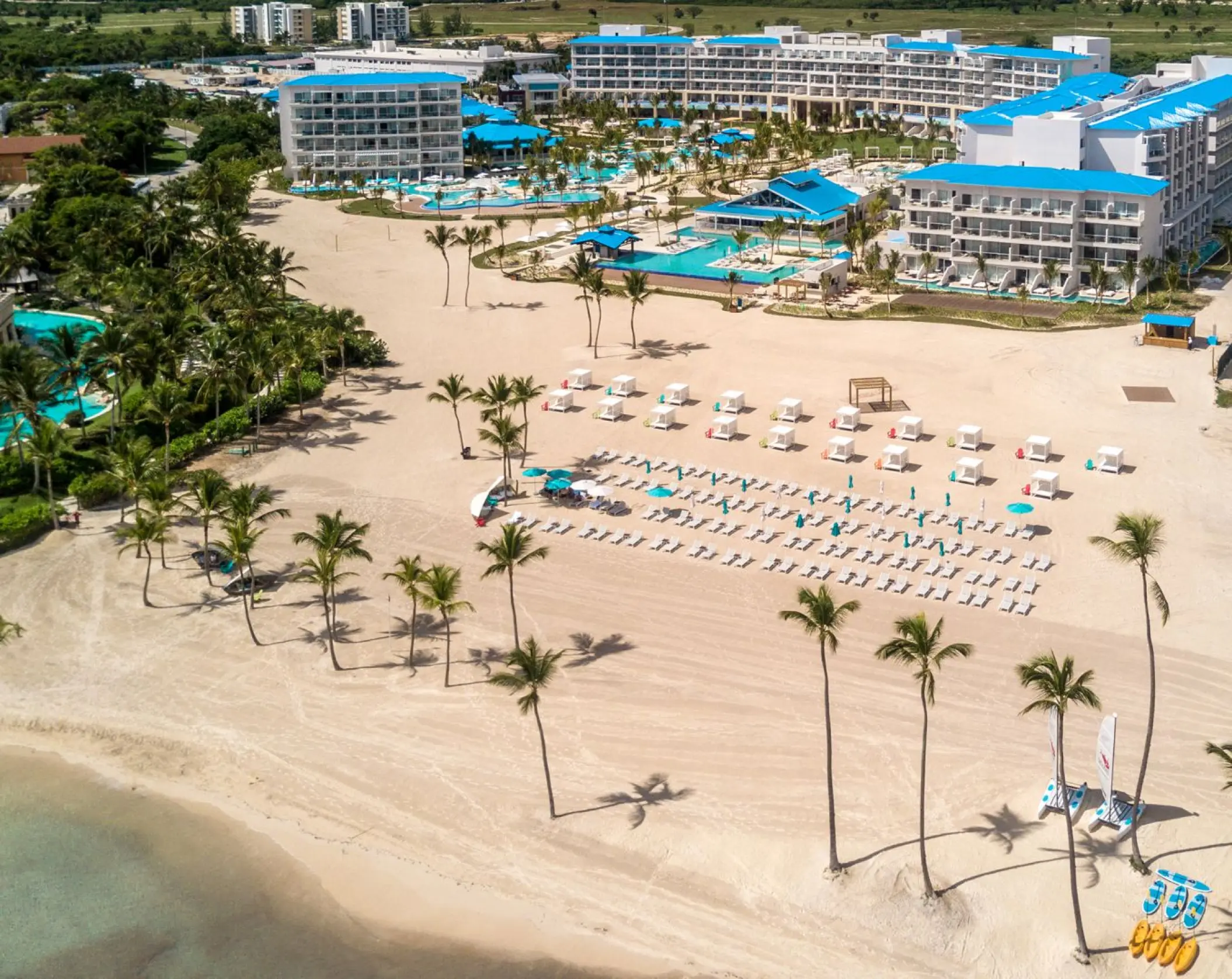 Aerial view of the beach and resort buildings at Margaritaville Island Reserve Cap Cana, Punta Cana