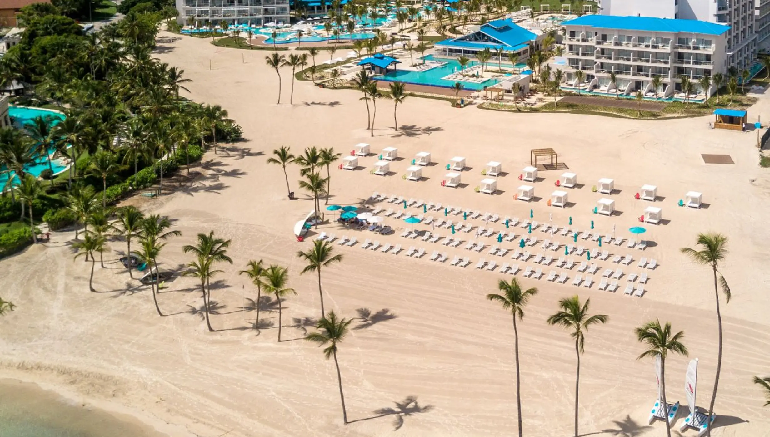 Aerial view of the beach and resort buildings at Margaritaville Island Reserve Cap Cana, Punta Cana