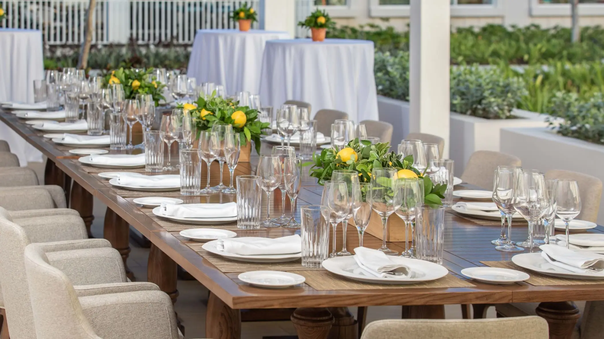 Outdoor wedding reception table with lemon centerpieces at Margaritaville Island Reserve Cap Cana, Punta Cana
