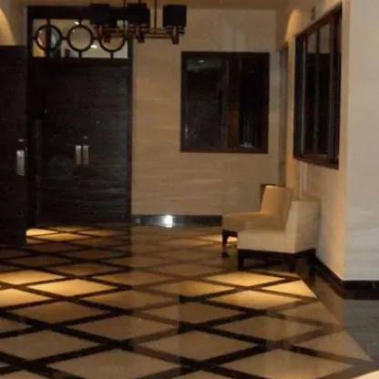 Margaritaville Island Reserve Riviera Cancun lobby foyer with black and white diamond tiled floors, Cancun