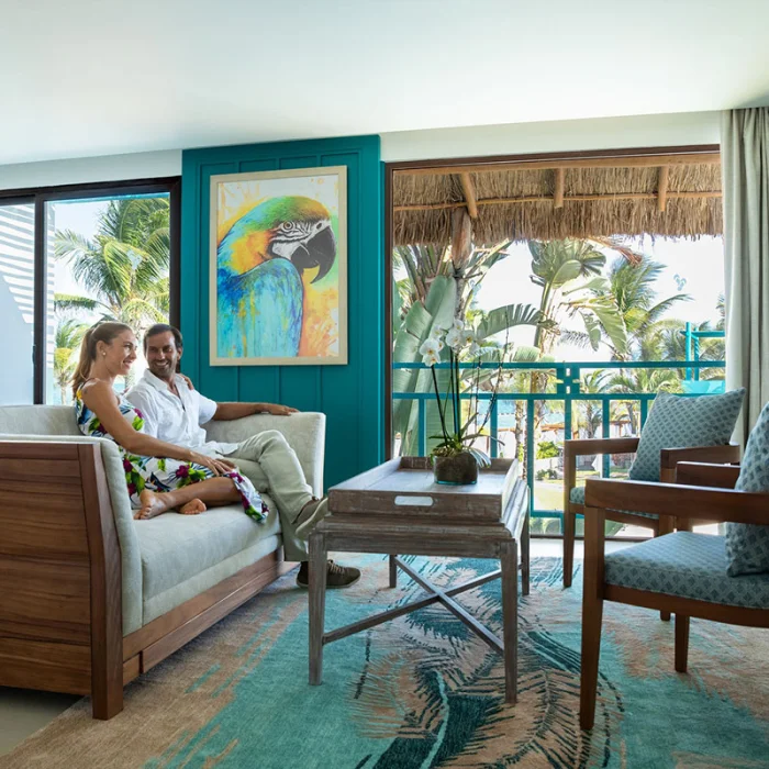 Couple at Margaritaville Island Reserve Riviera Cancun master suite.