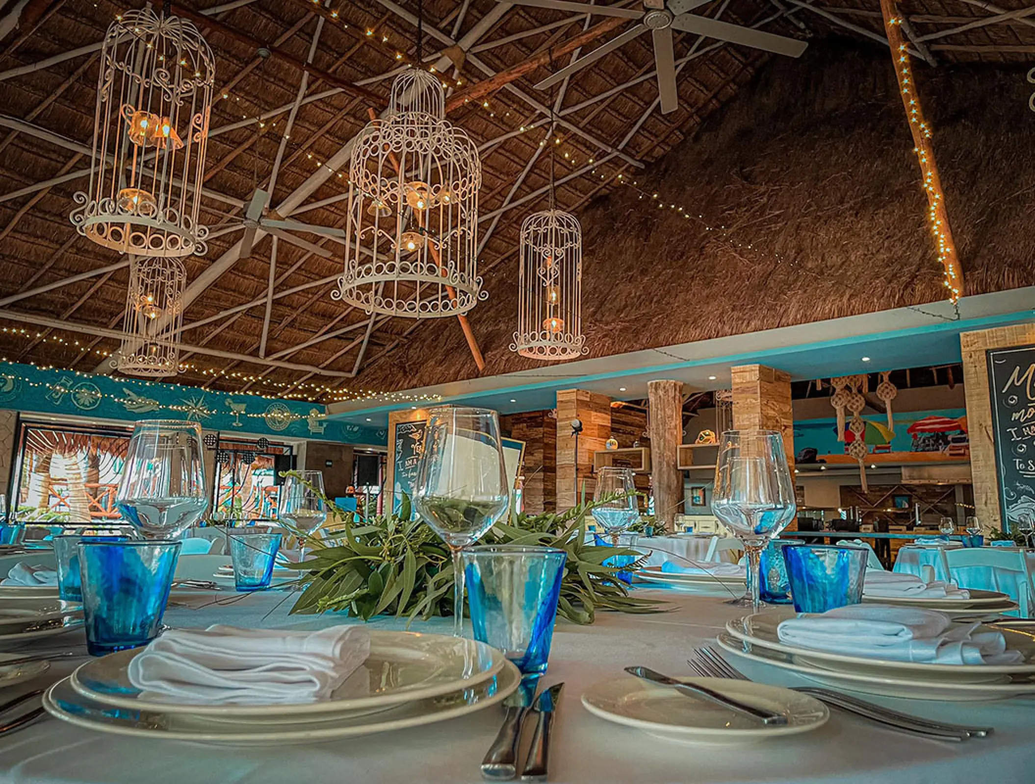 The Beach House restaurant with birdcage lighting at Margaritaville Island Reserve Riviera Cancun
