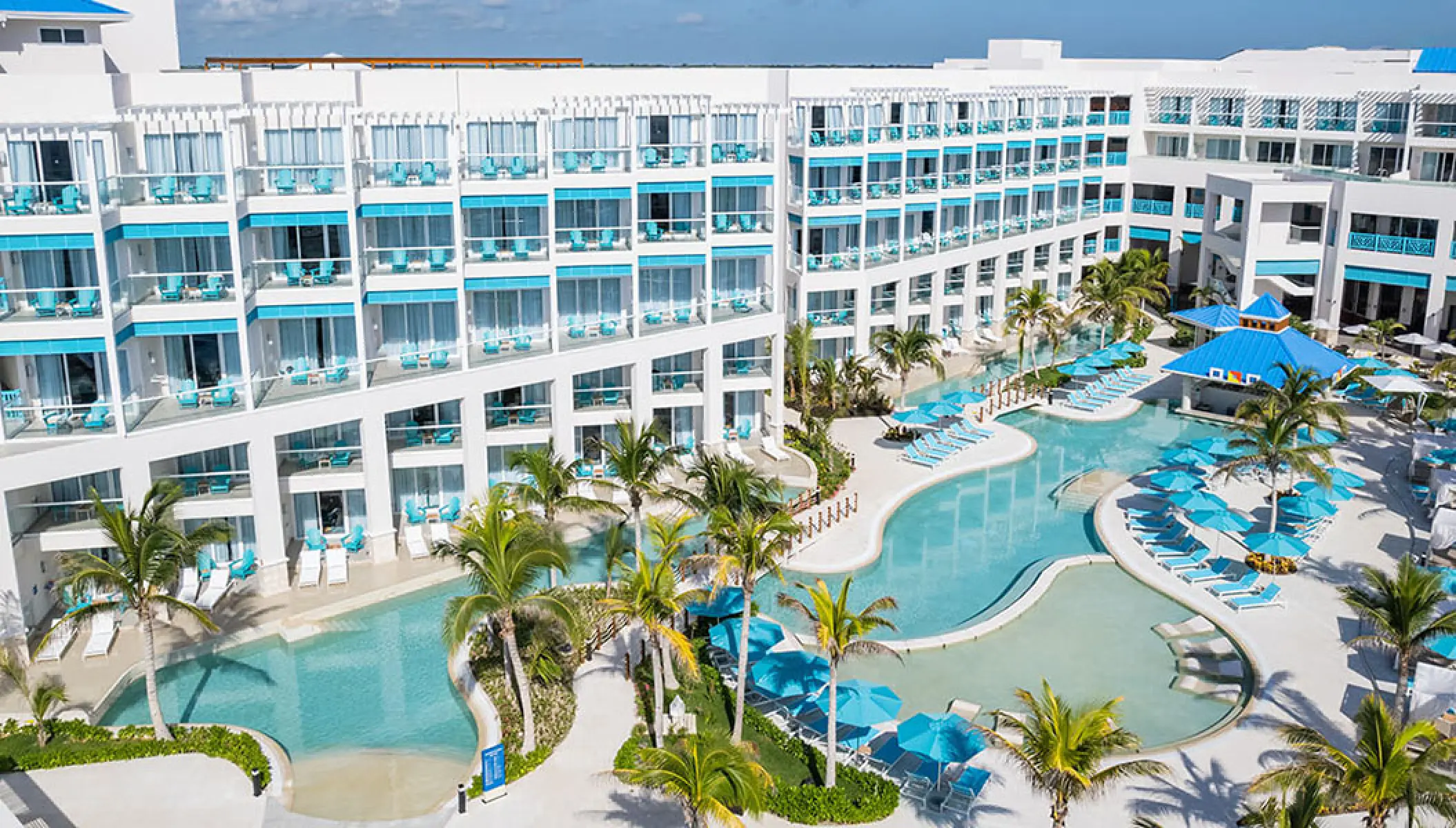 Aerial view of the pools and guest room buildings at Margaritaville Island Reserve Riviera Maya