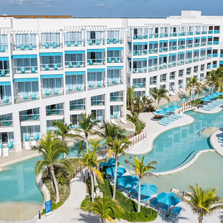 Aerial view of the pools and guest room buildings at Margaritaville Island Reserve Riviera Maya