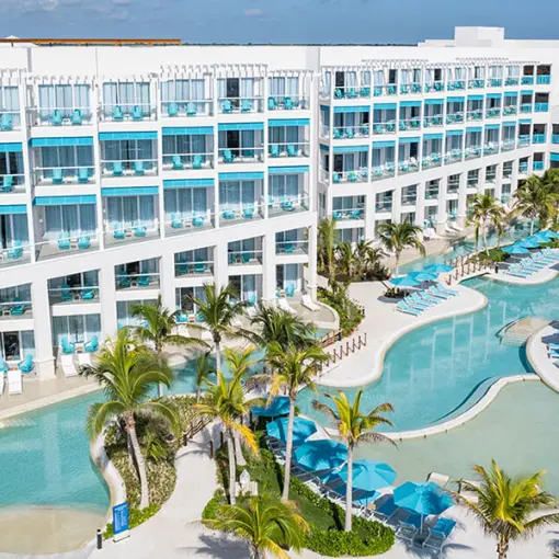 Aerial view of the pools and guest room buildings at Margaritaville Island Reserve Riviera Maya