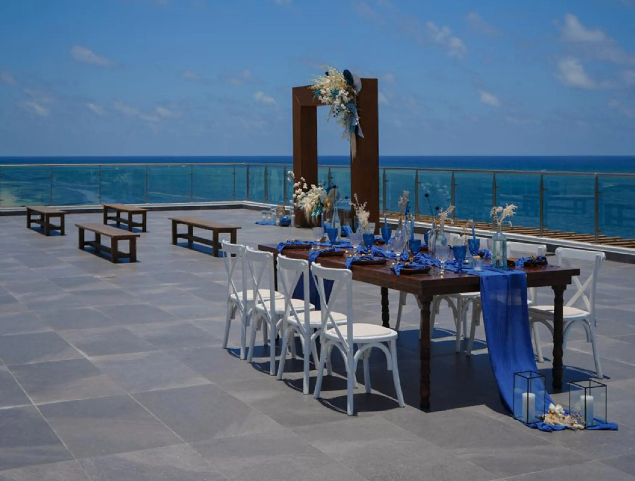 Rooftop wedding reception and ceremony setup overlooking the ocean at Margaritaville Island Reserve Riviera Maya