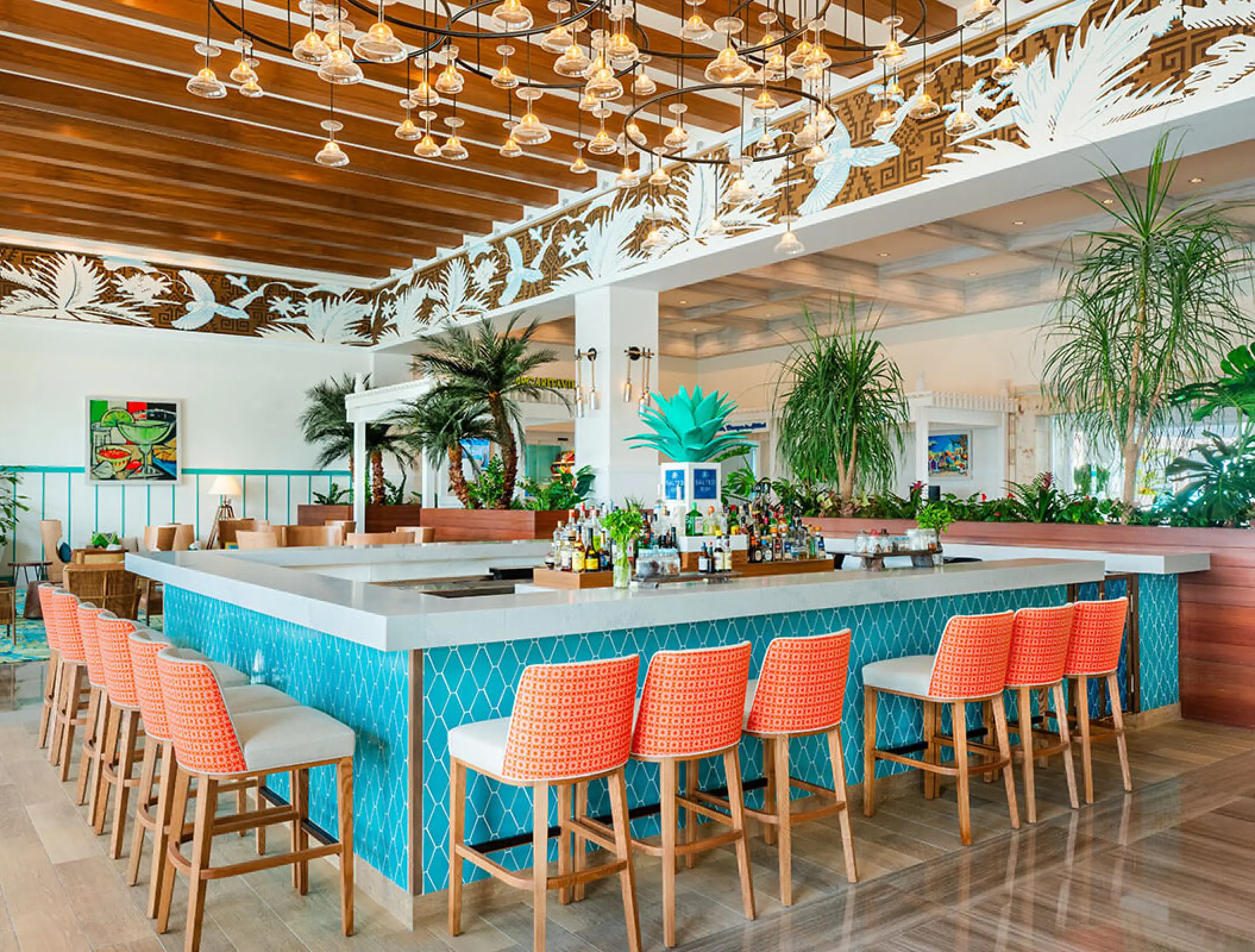 Salted Rim bar with teal tiles and orange stools at Margaritaville Island Reserve Riviera Maya