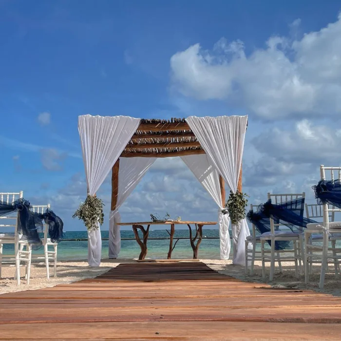 Ceremony decor in beach venue at Margaritaville Island Reserve Riviera Cancun.