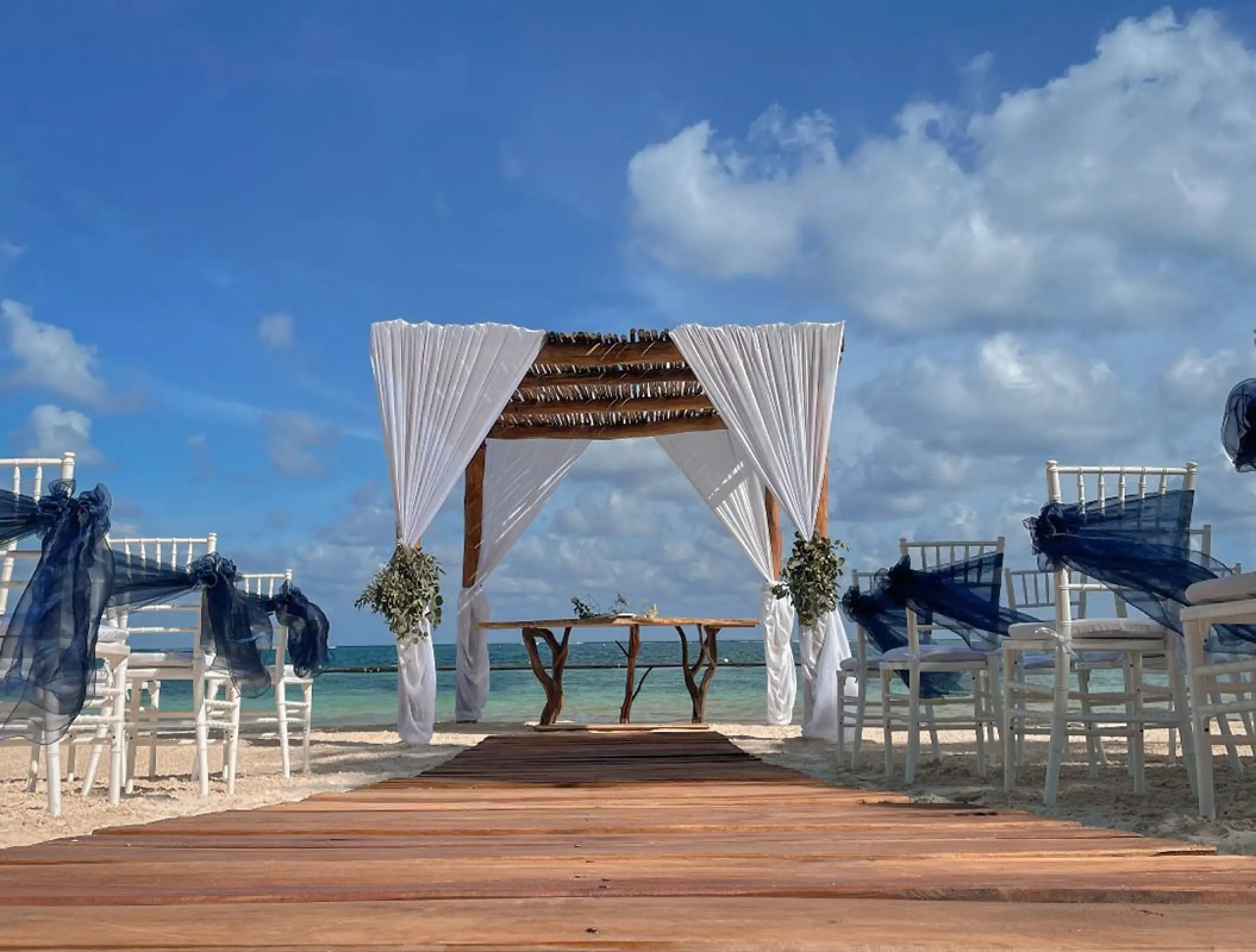 Beach wedding ceremony setup at Margaritaville Riviera Cancun, Cancun
