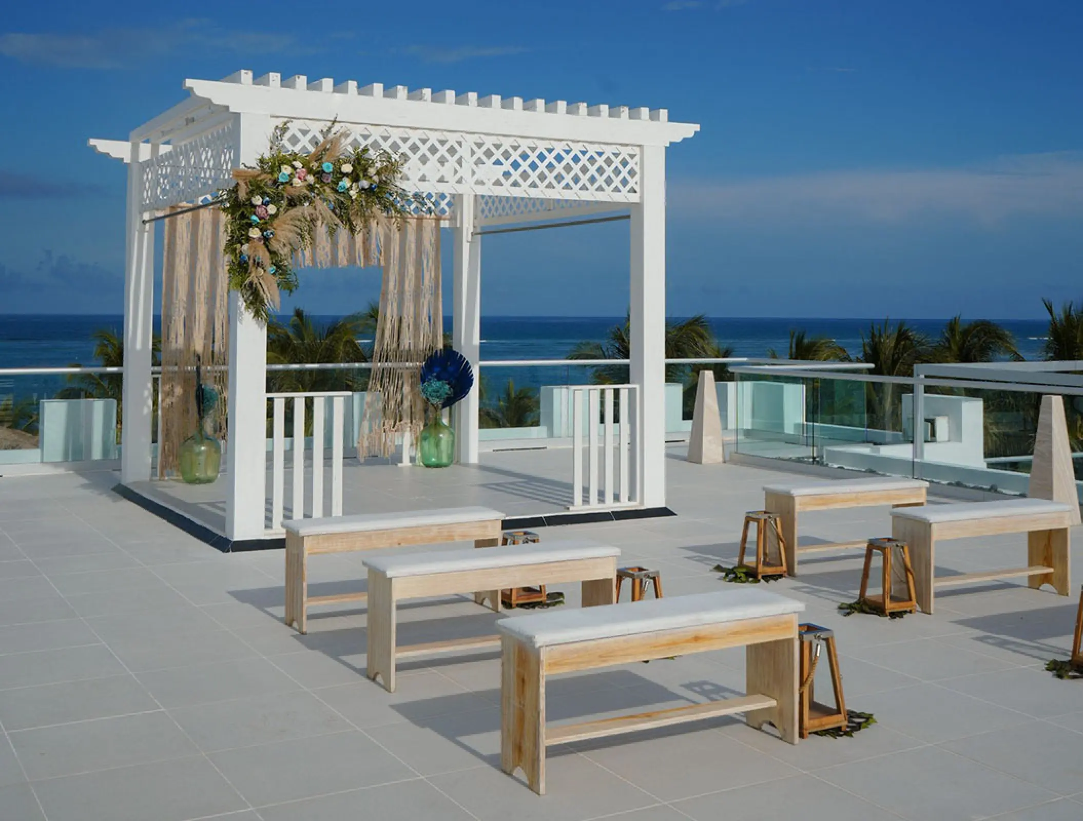 Sky wedding ceremony terrace with white pergola at Margaritaville Island Reserve Riviera Cancun