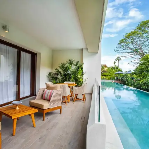 Marival Armony suite balcony with a swim-up pool and patio furniture, Puerto Vallarta