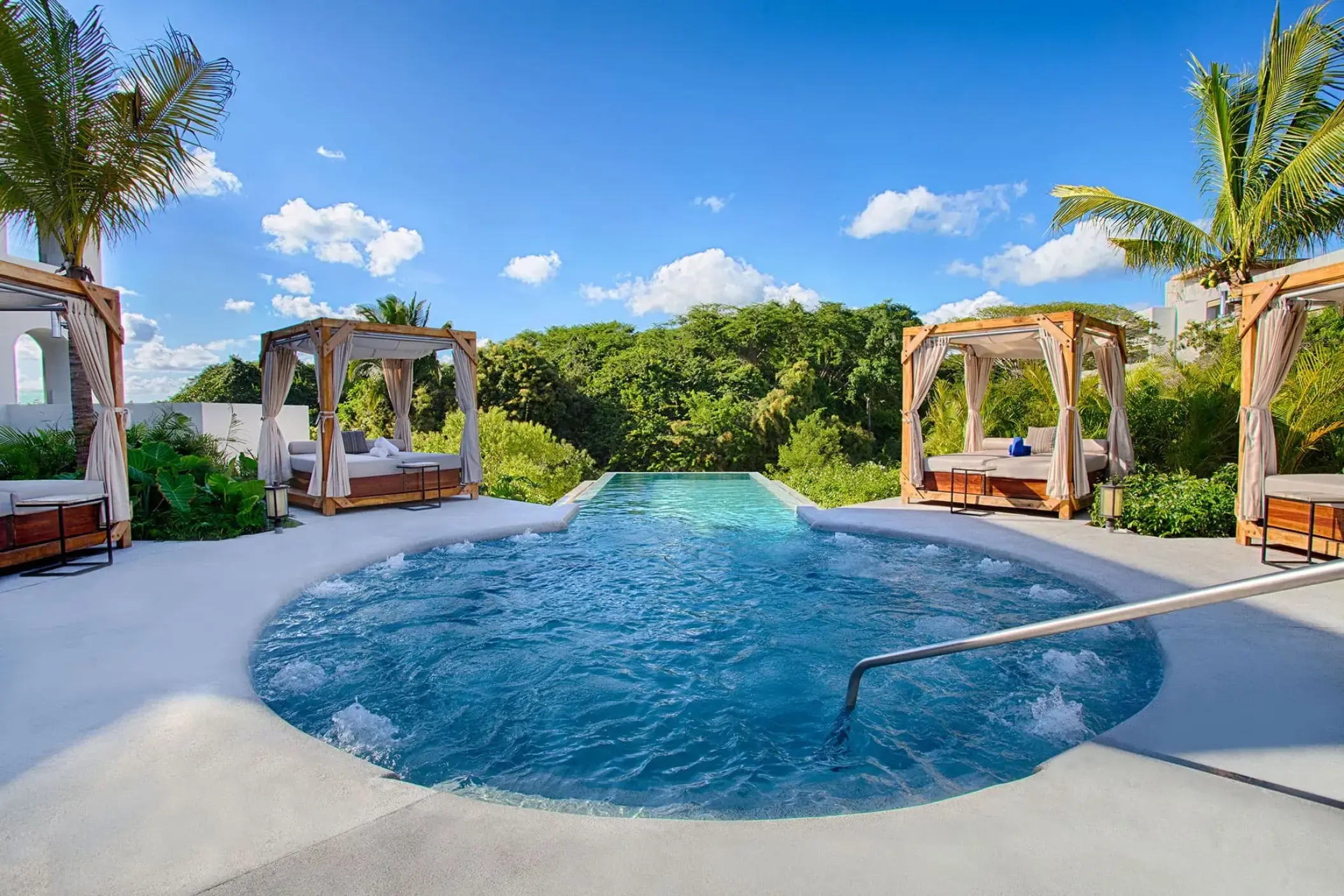 Armony Marival outdoor jacuzzi pool with wooden cabanas and tropical greenery, Puerto Vallarta