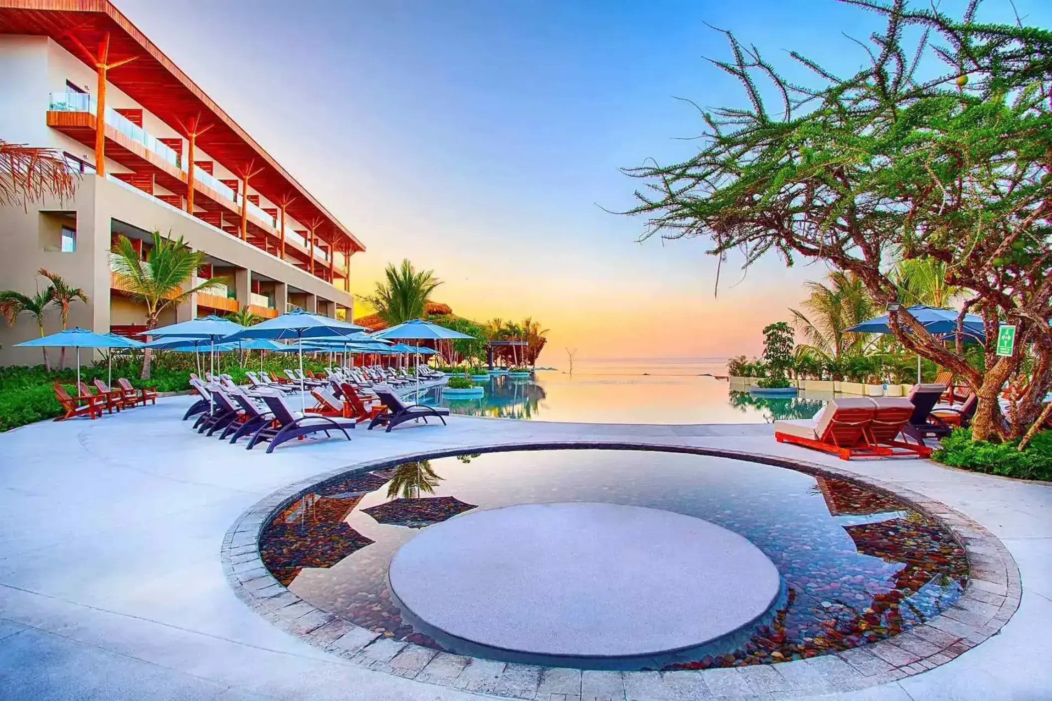 Armony Marival main pool and sun loungers at sunset, Puerto Vallarta