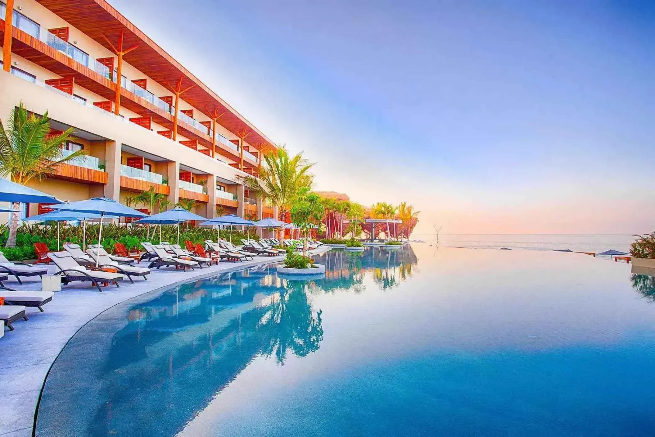 Infinity pool and lounge chairs at Marival Armony, Puerto Vallarta