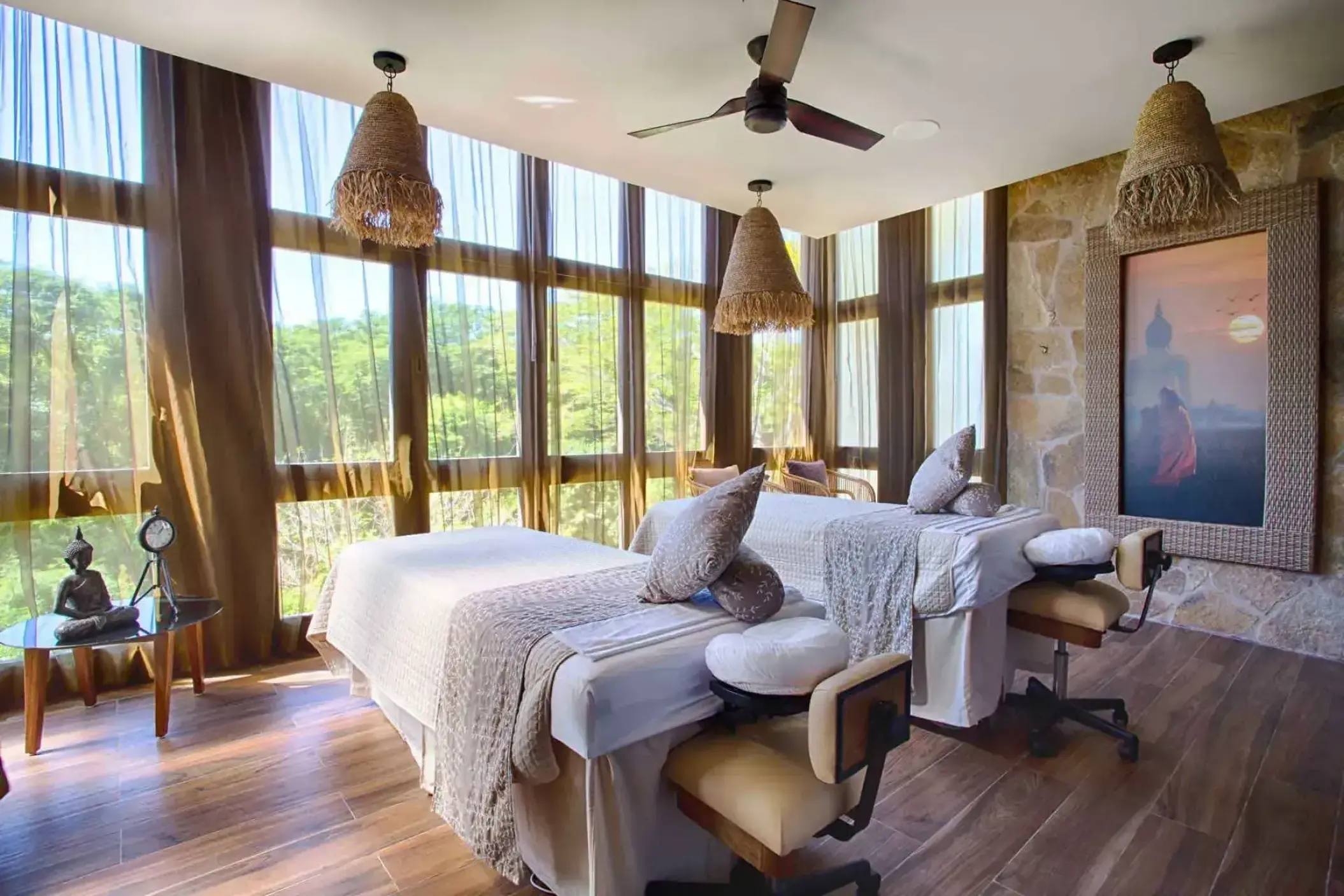 Couples massage room with floor-to-ceiling windows at Marival Armony, Puerto Vallarta