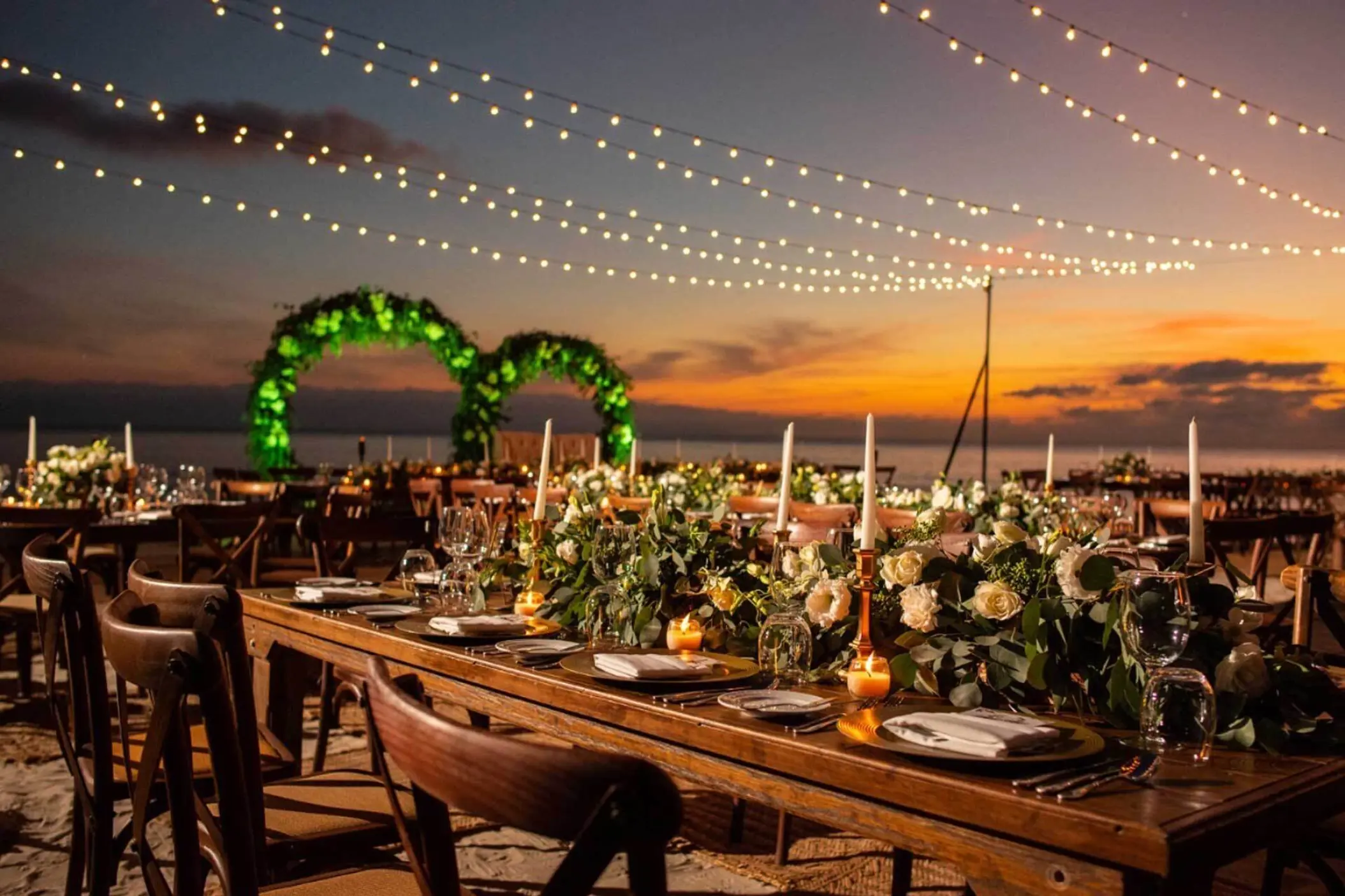 Beach wedding reception with string lights at Marival Armony, Puerto Vallarta