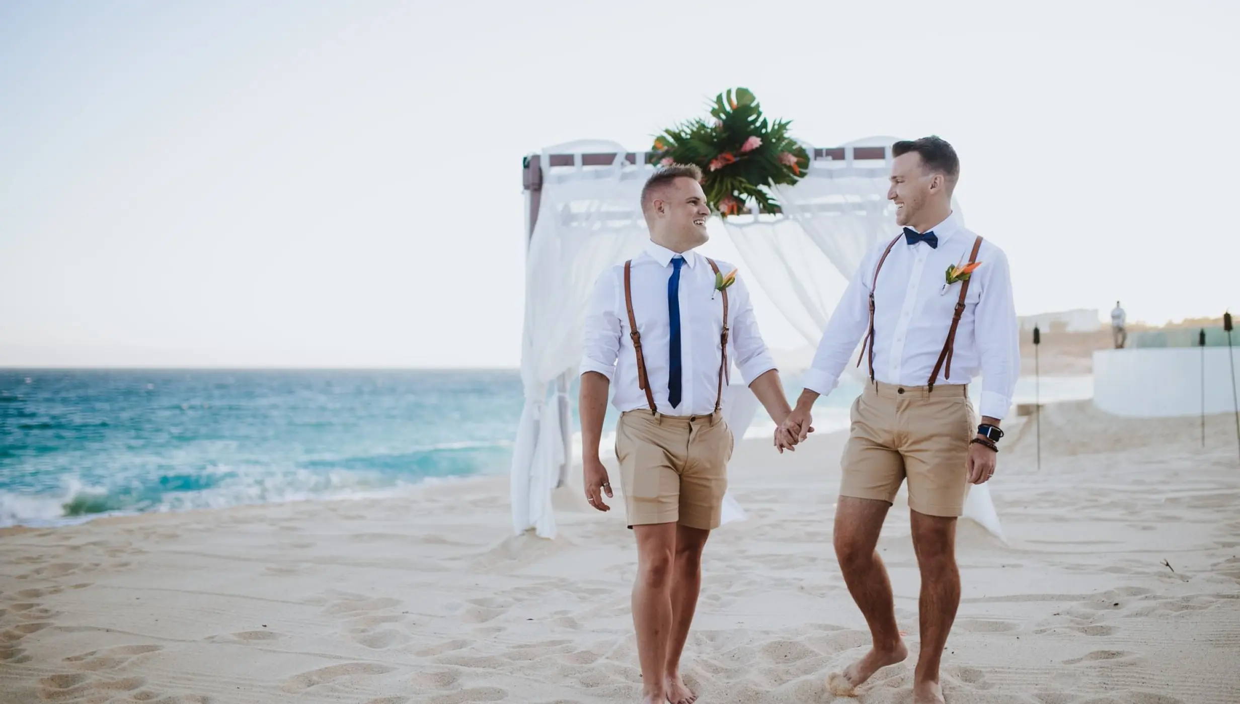 Gay couple on their ceremony at the Marquis Los Cabos beach