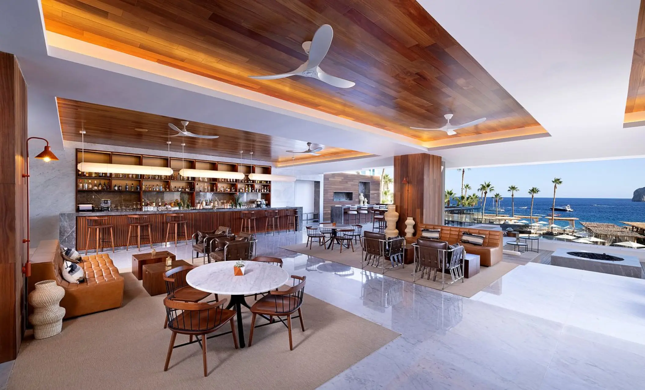 Modern open-air lobby and bar area at ME Cabo, Cabo San Lucas
