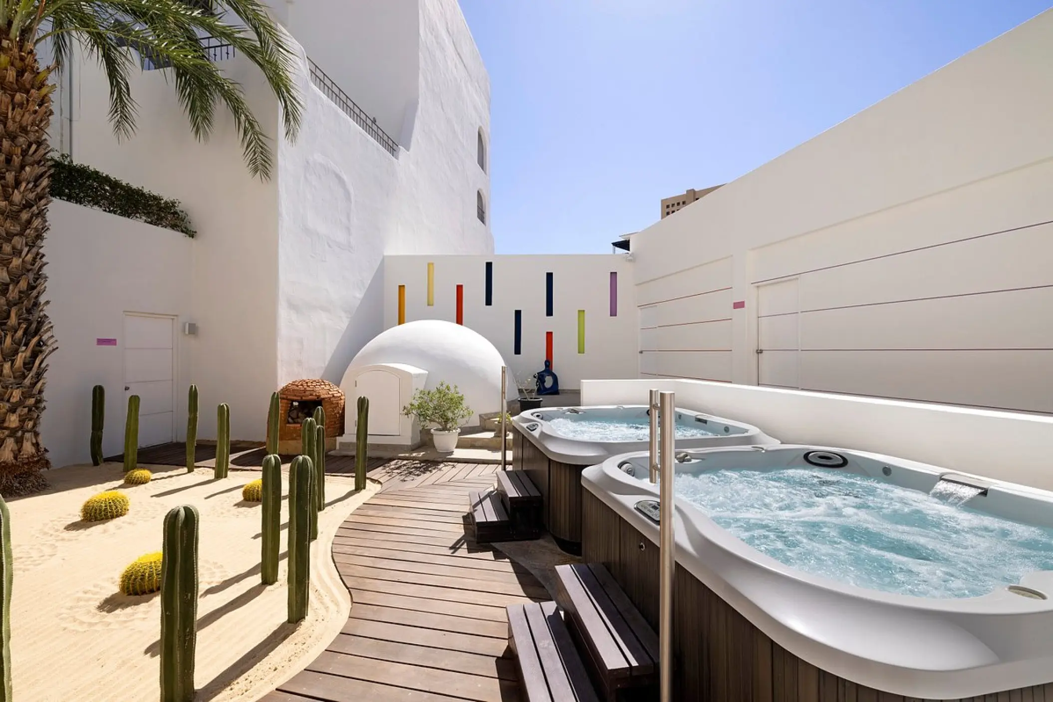 Outdoor hot tubs and cactus garden at ME Cabo, Cabo San Lucas