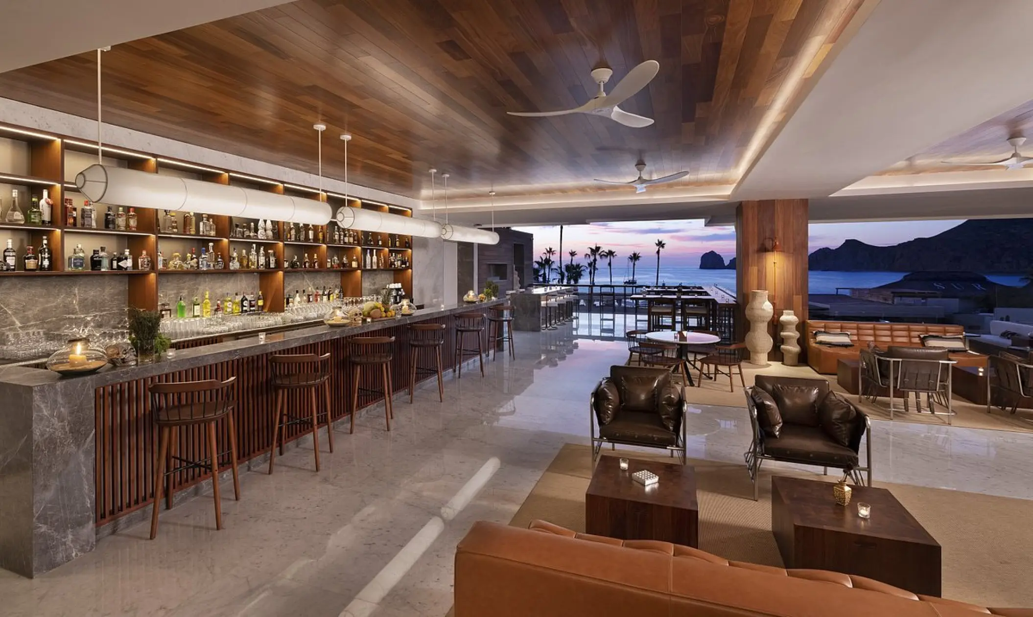 Modern lobby bar with wood ceilings and ocean views at ME Cabo, Cabo San Lucas