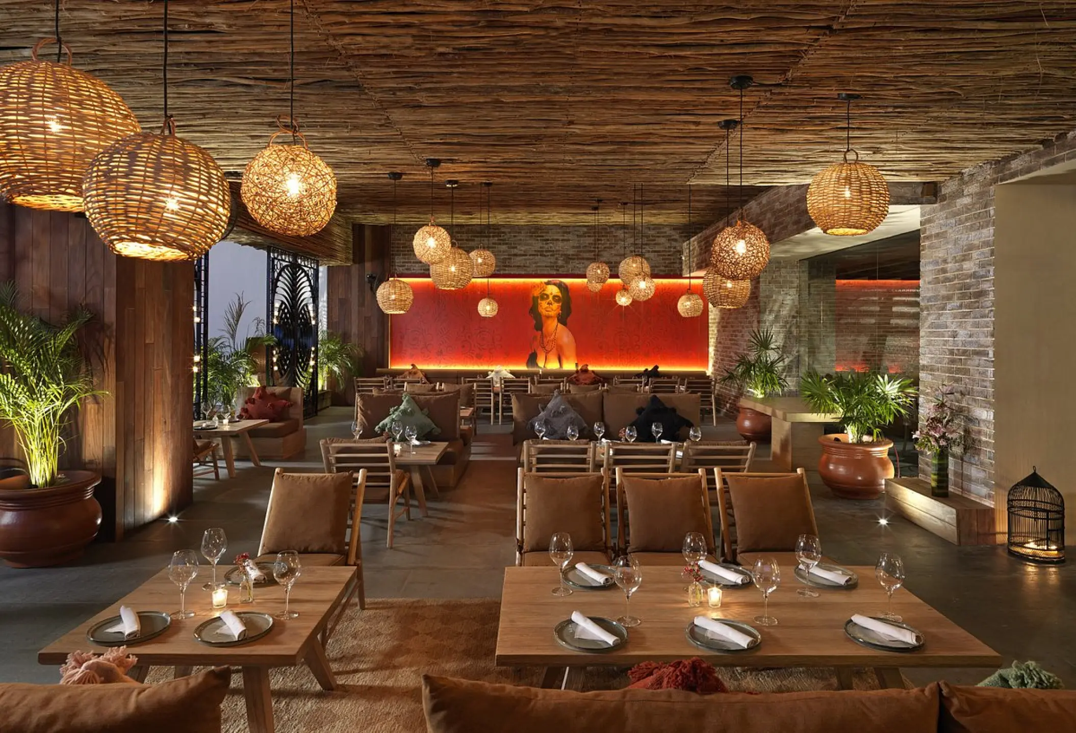 Mamazzita Mexican Soul restaurant with wicker pendant lights at ME Cabo, Cabo San Lucas