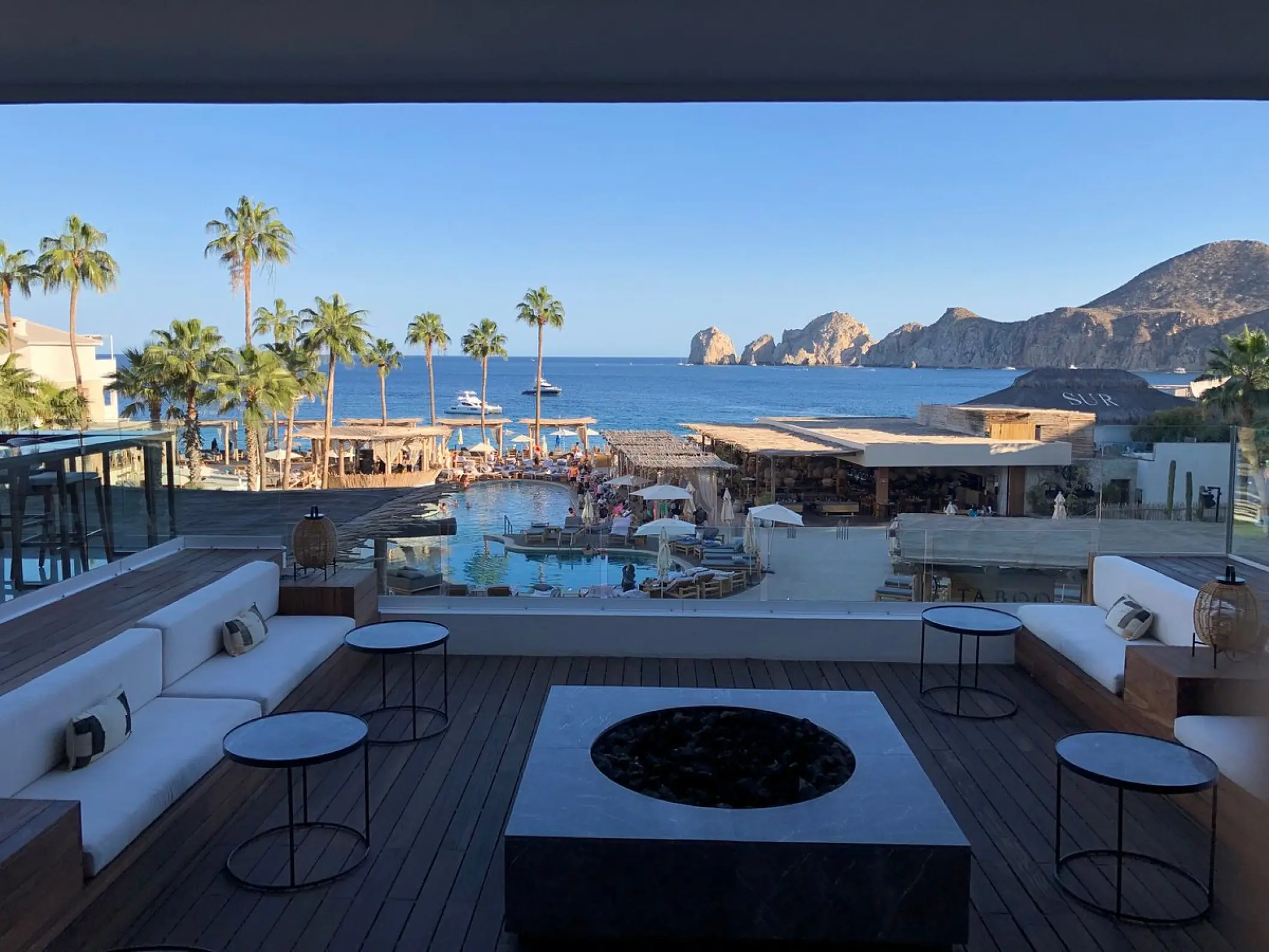 Terrace lounge with fire pit overlooking the pool and ocean at ME Cabo, Cabo San Lucas
